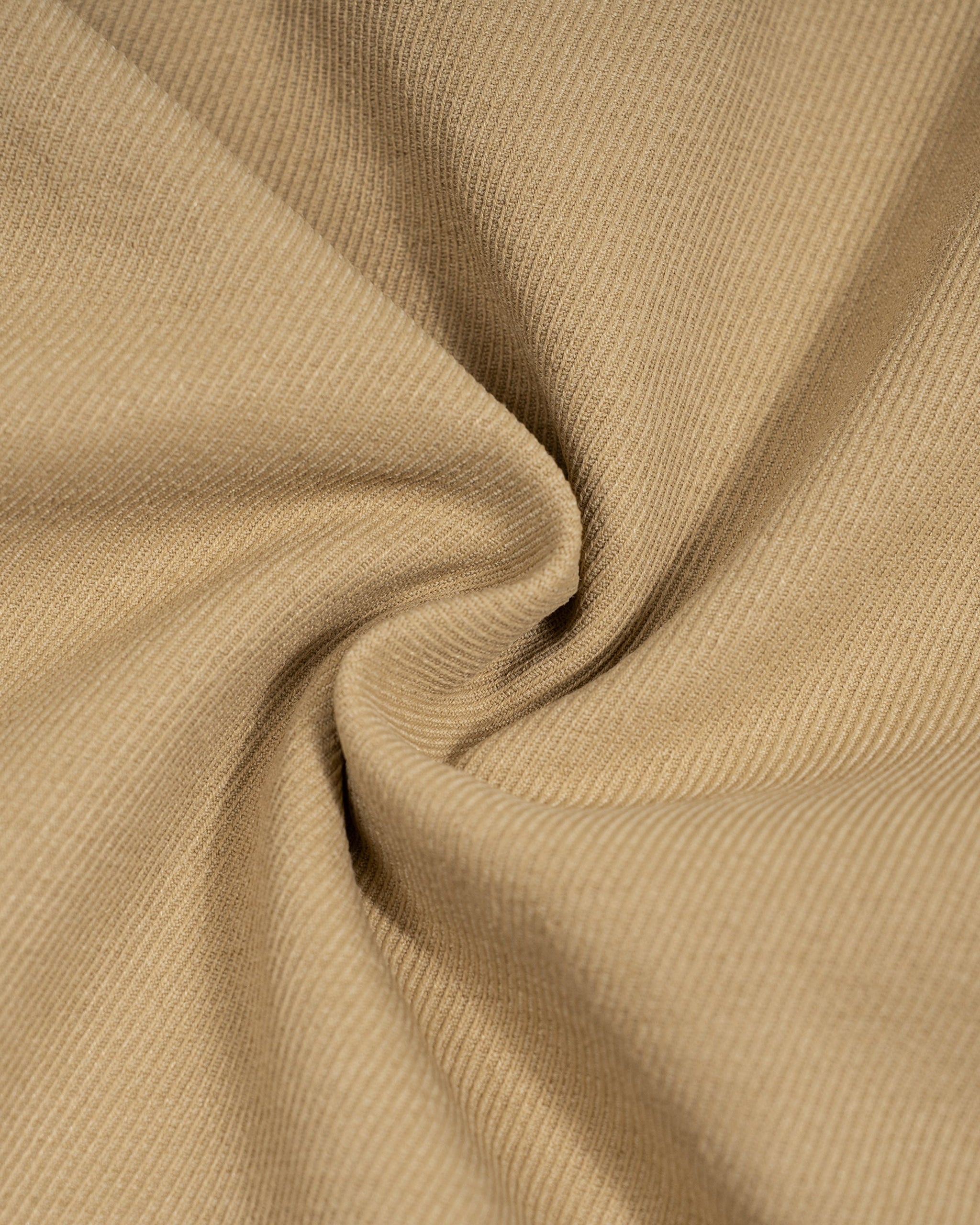 Close-up of beige fabric with folds