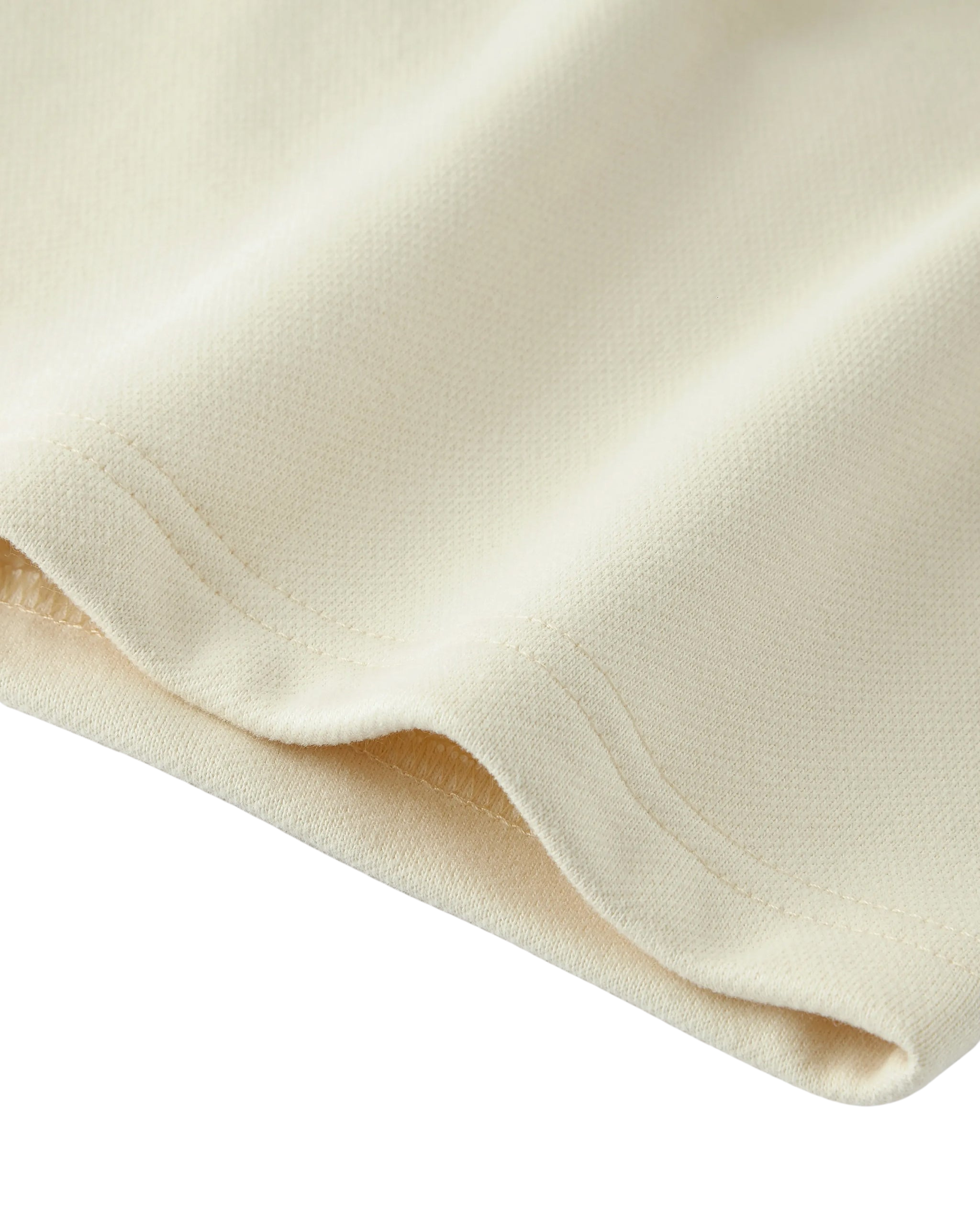 Close-up of beige fabric with a soft texture on a white background