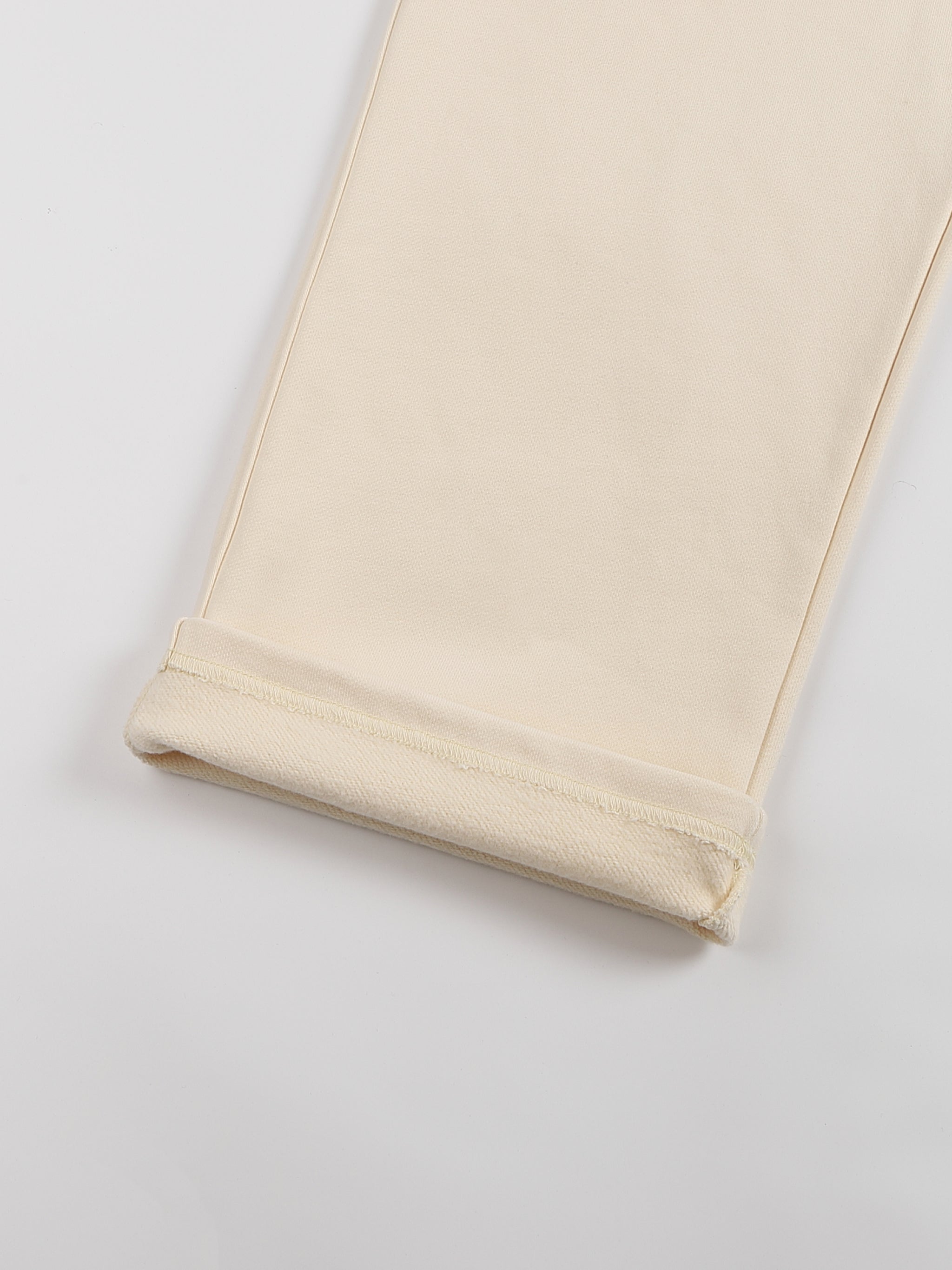 Beige leggings on a light gray background
