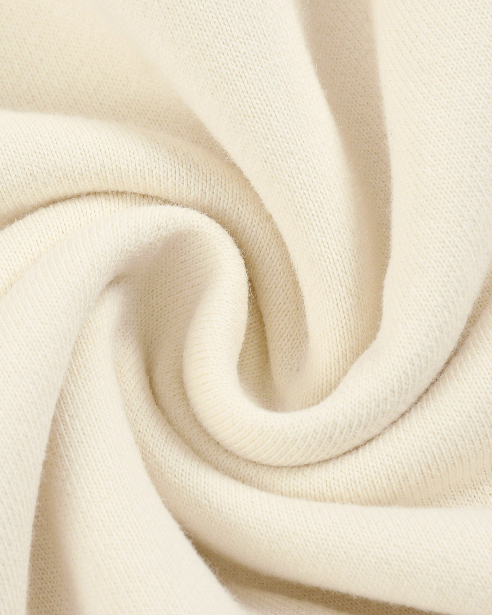 Close-up of beige fabric with a soft texture