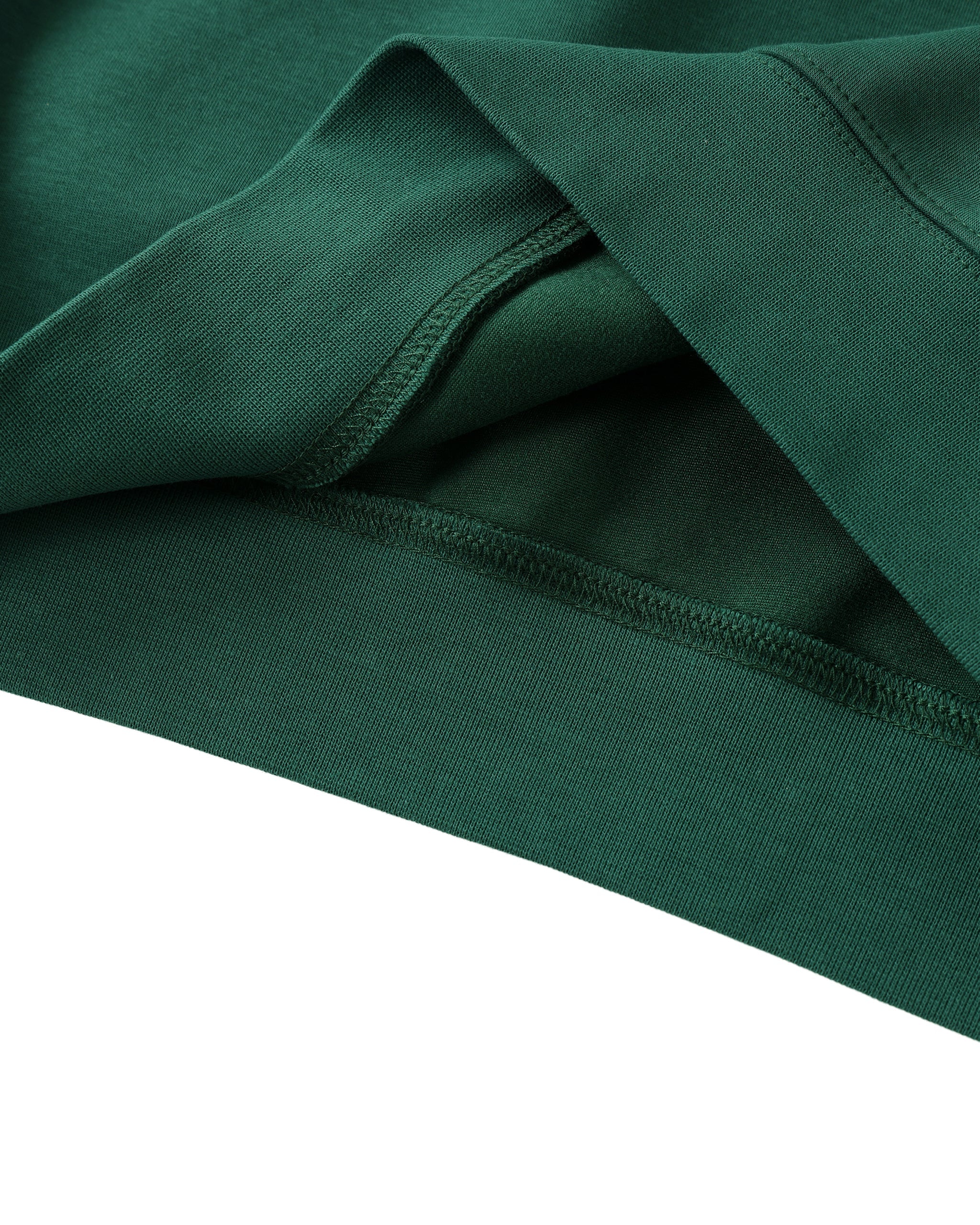 Close-up of green fabric with a white background
