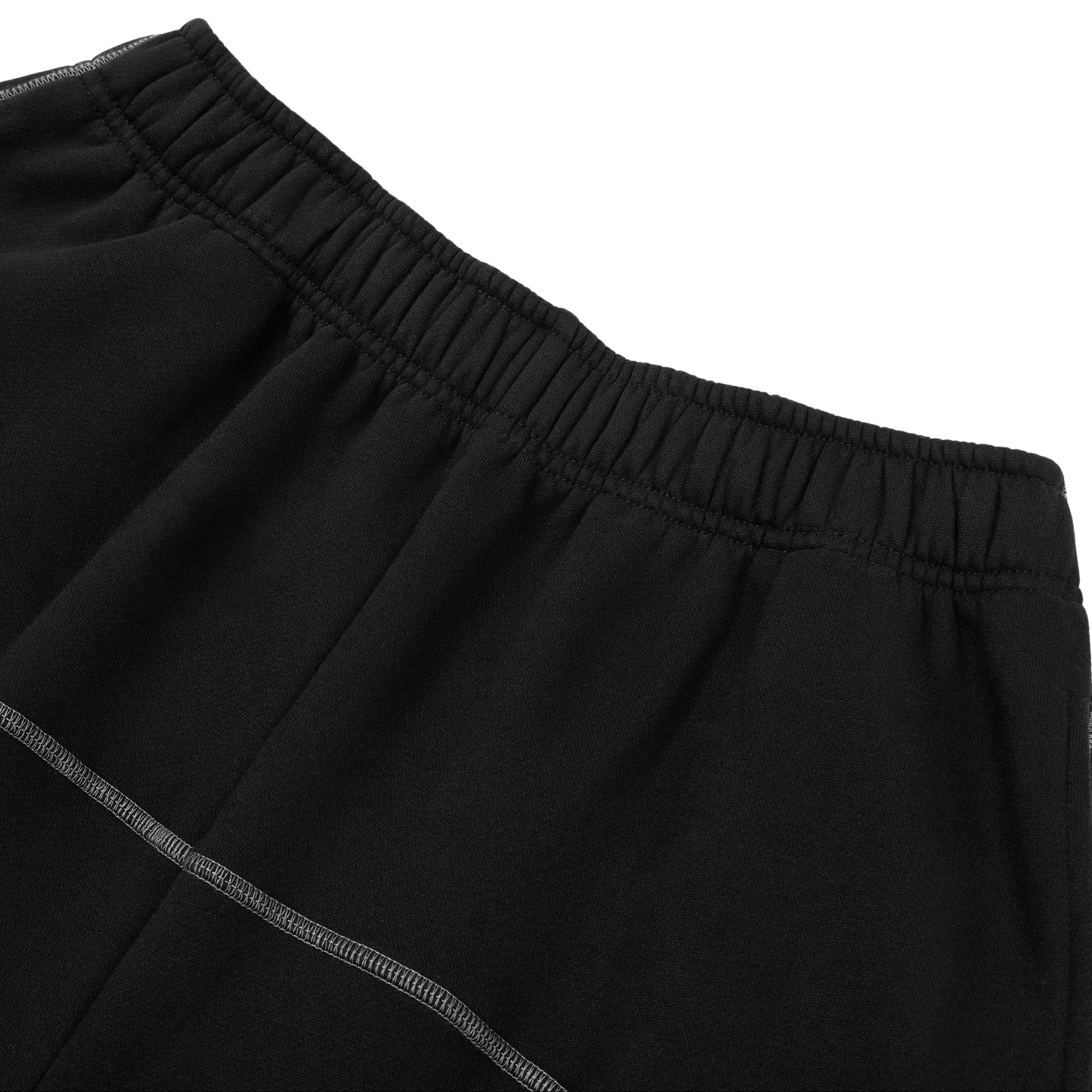 Close-up of black pants with a white background