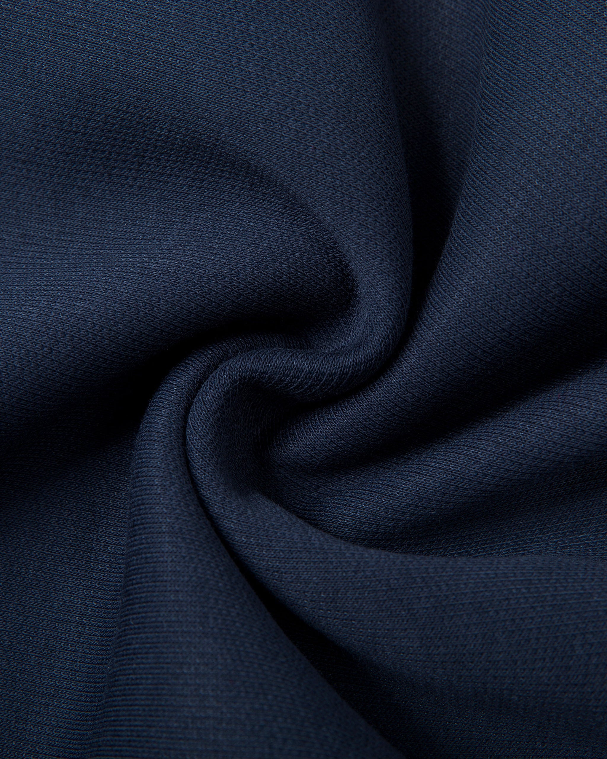 Close-up of dark blue fabric with folds