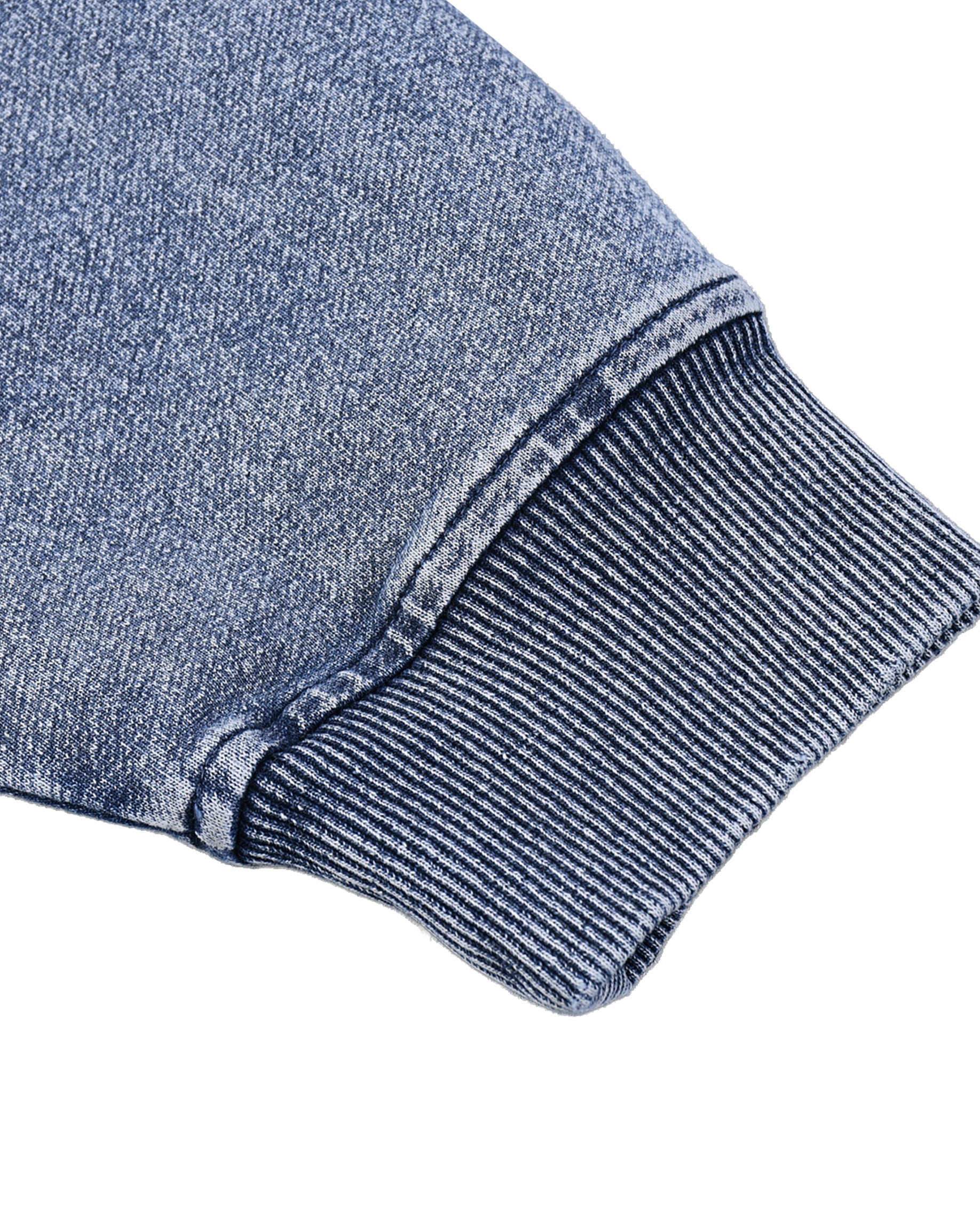 Close-up of a blue denim fabric with a white background