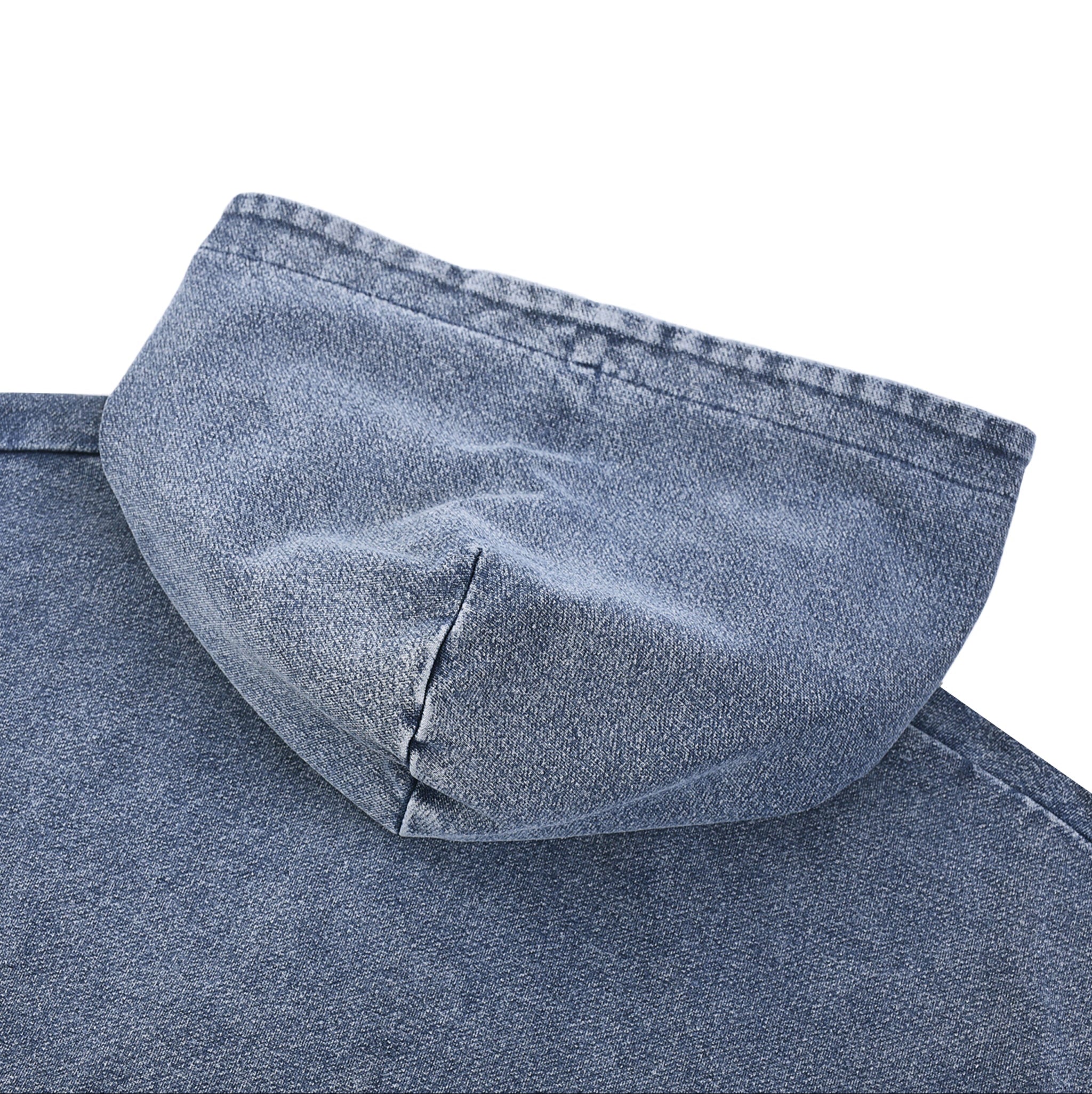Close-up of a blue denim fabric with a hood on a white background