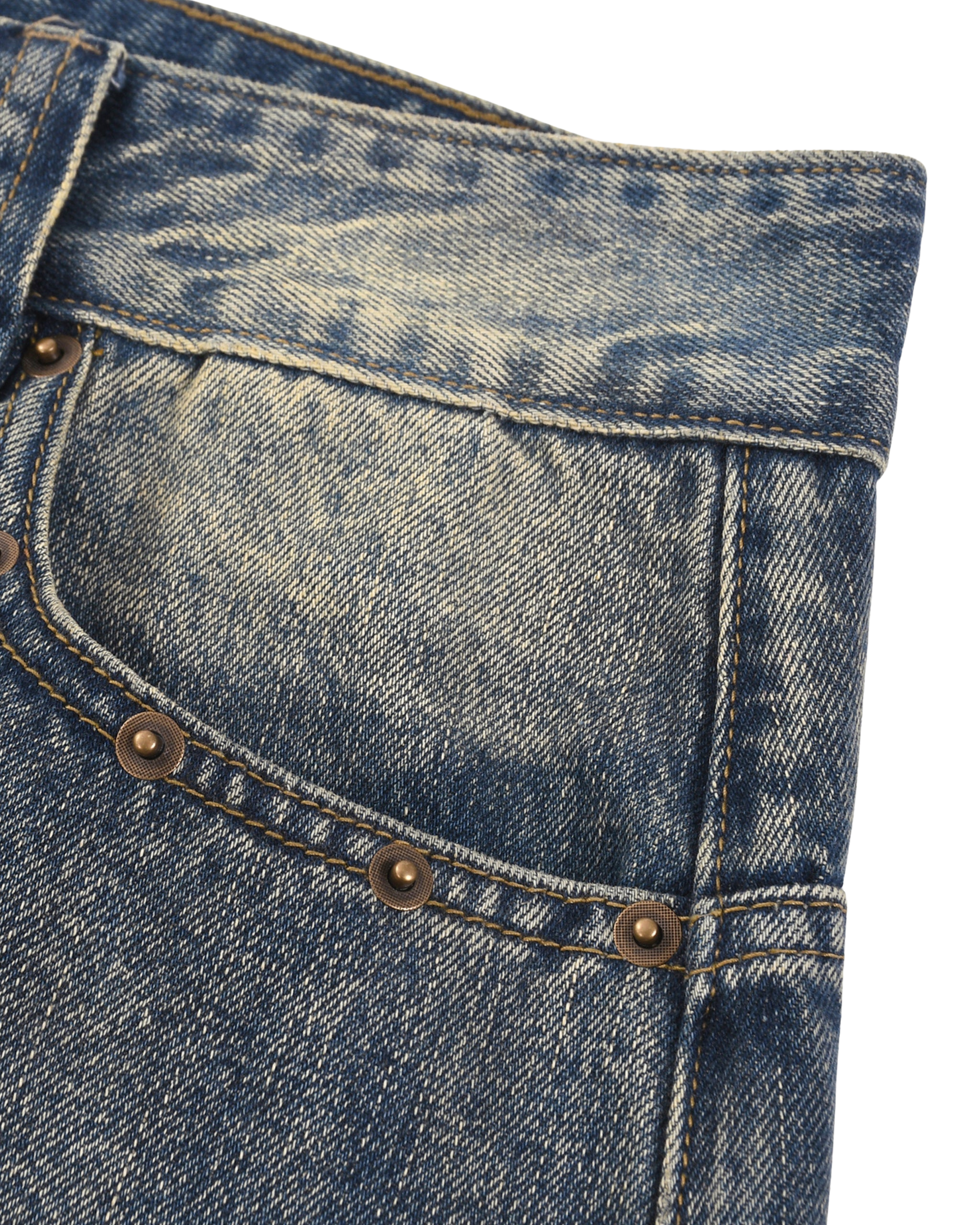 Close-up of blue denim jeans with stitching and buttons on a white background