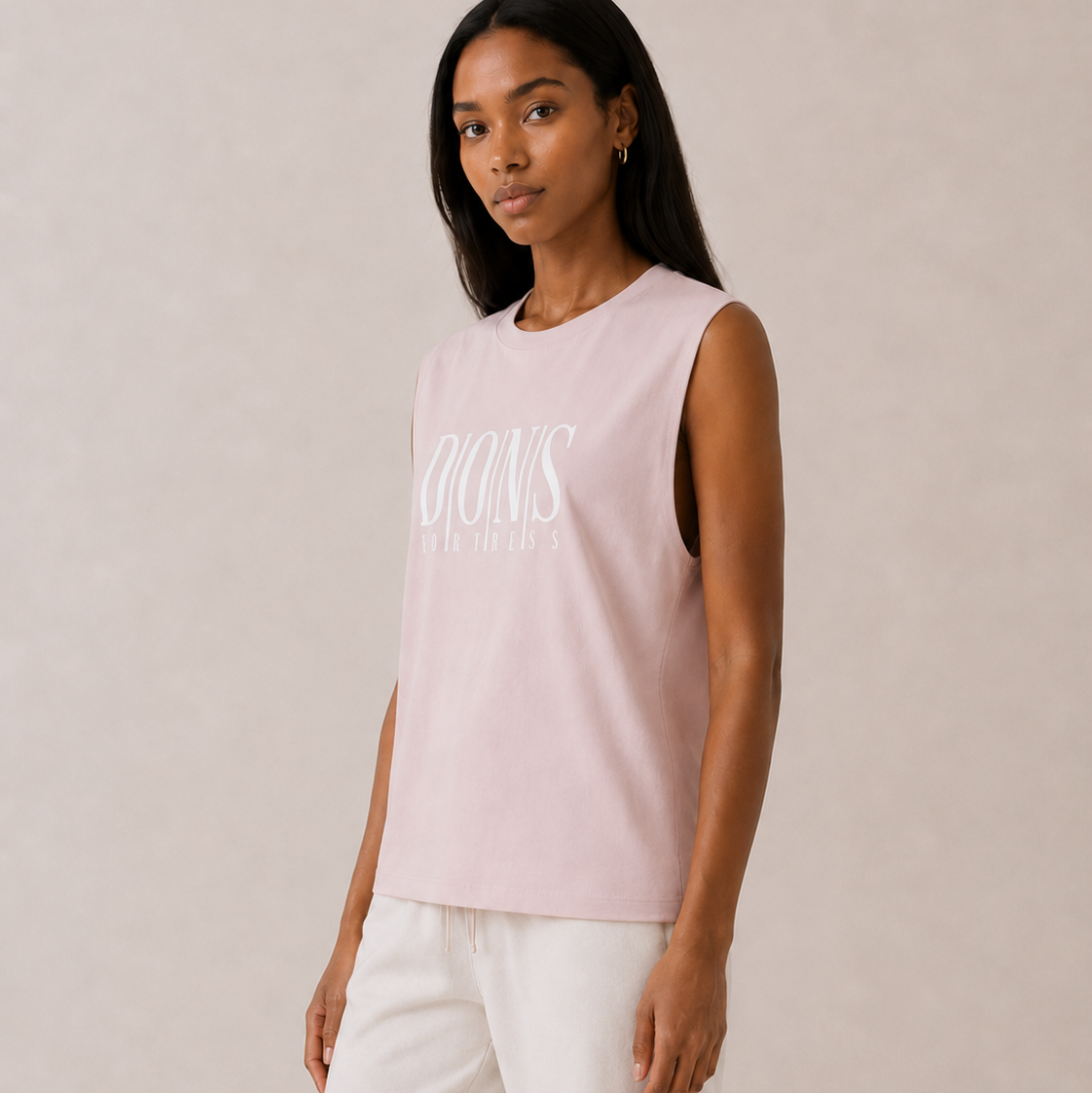 Woman wearing a light pink sleeveless top with text on a plain background