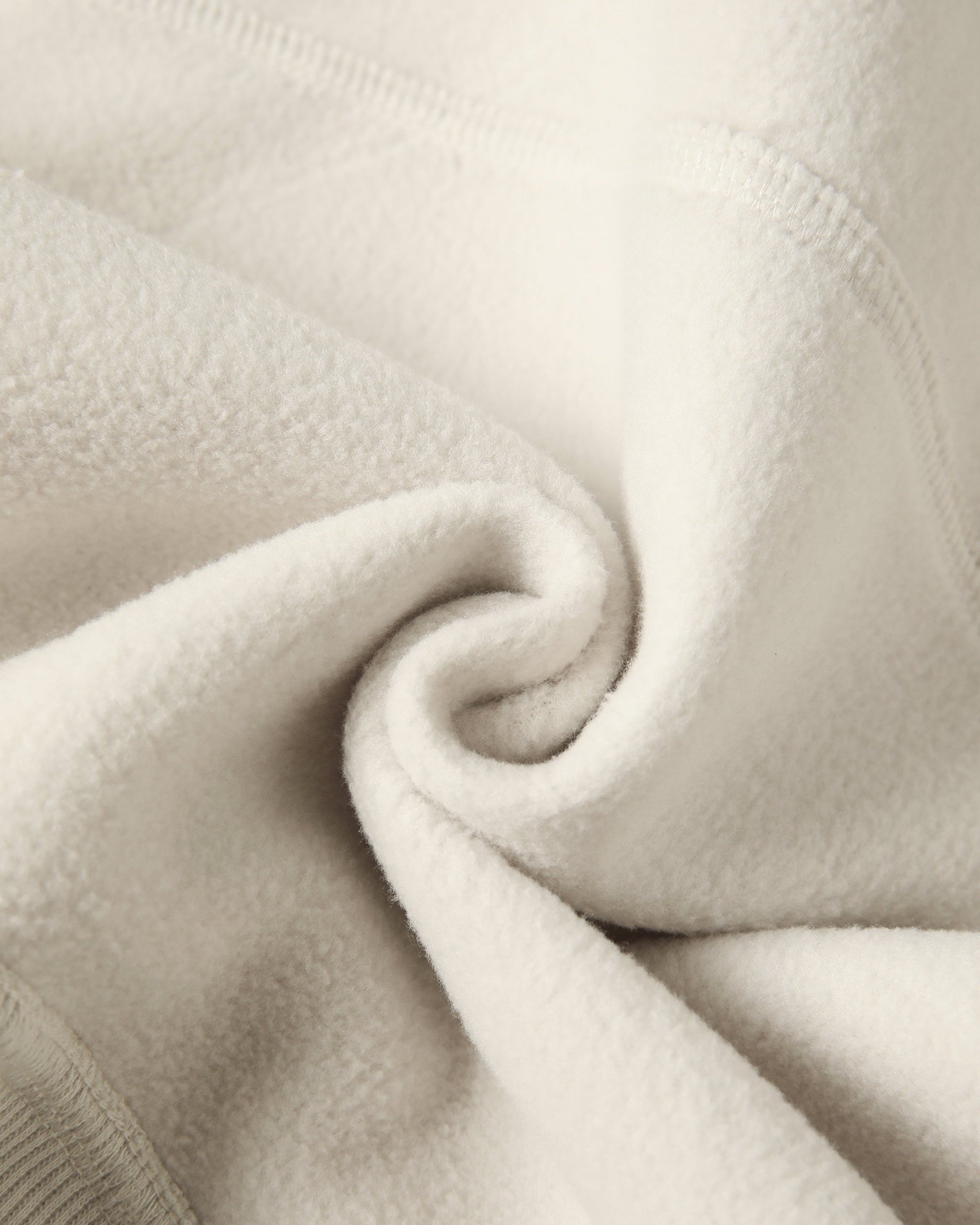Close-up of beige fabric with a subtle texture