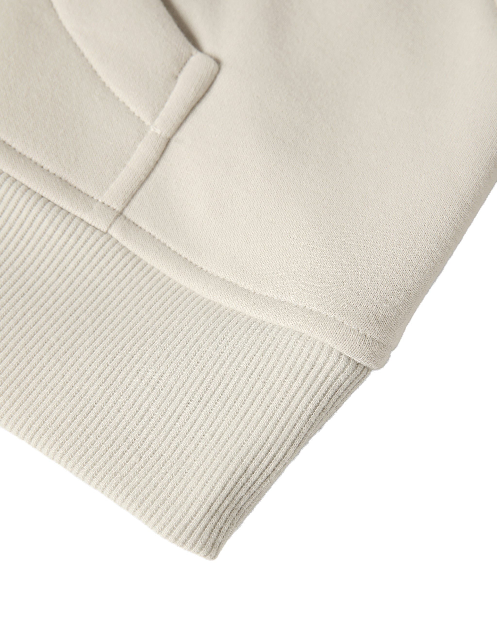 Close-up of a beige fabric texture on a white background