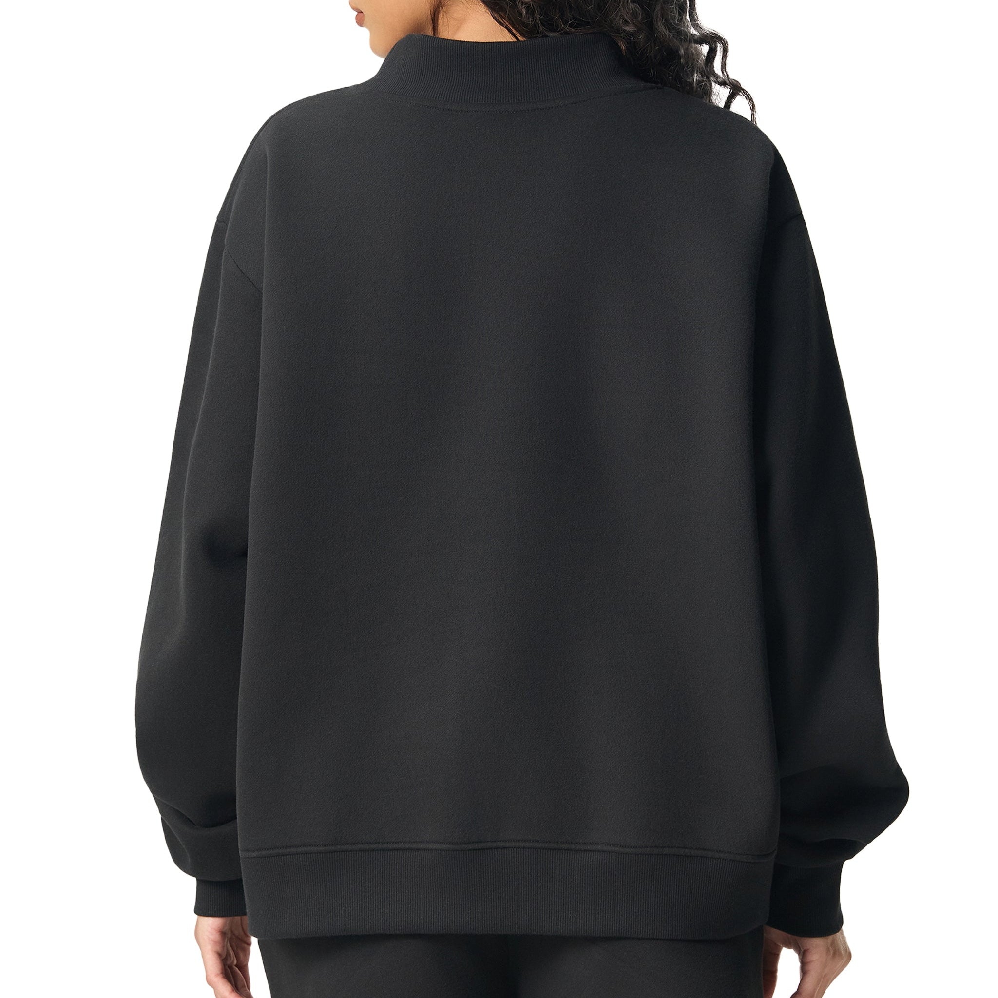 Person wearing a black sweatshirt and shorts on a white background