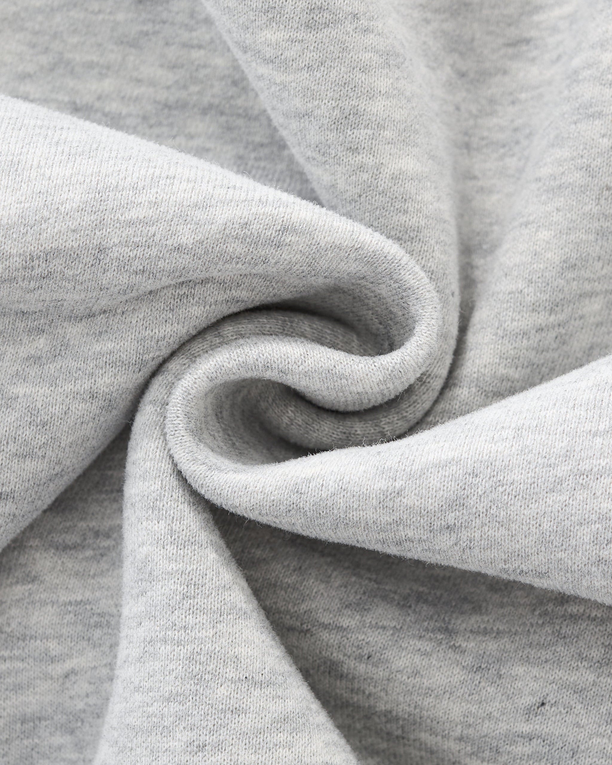 Close-up of gray fabric with a focus on texture and folds