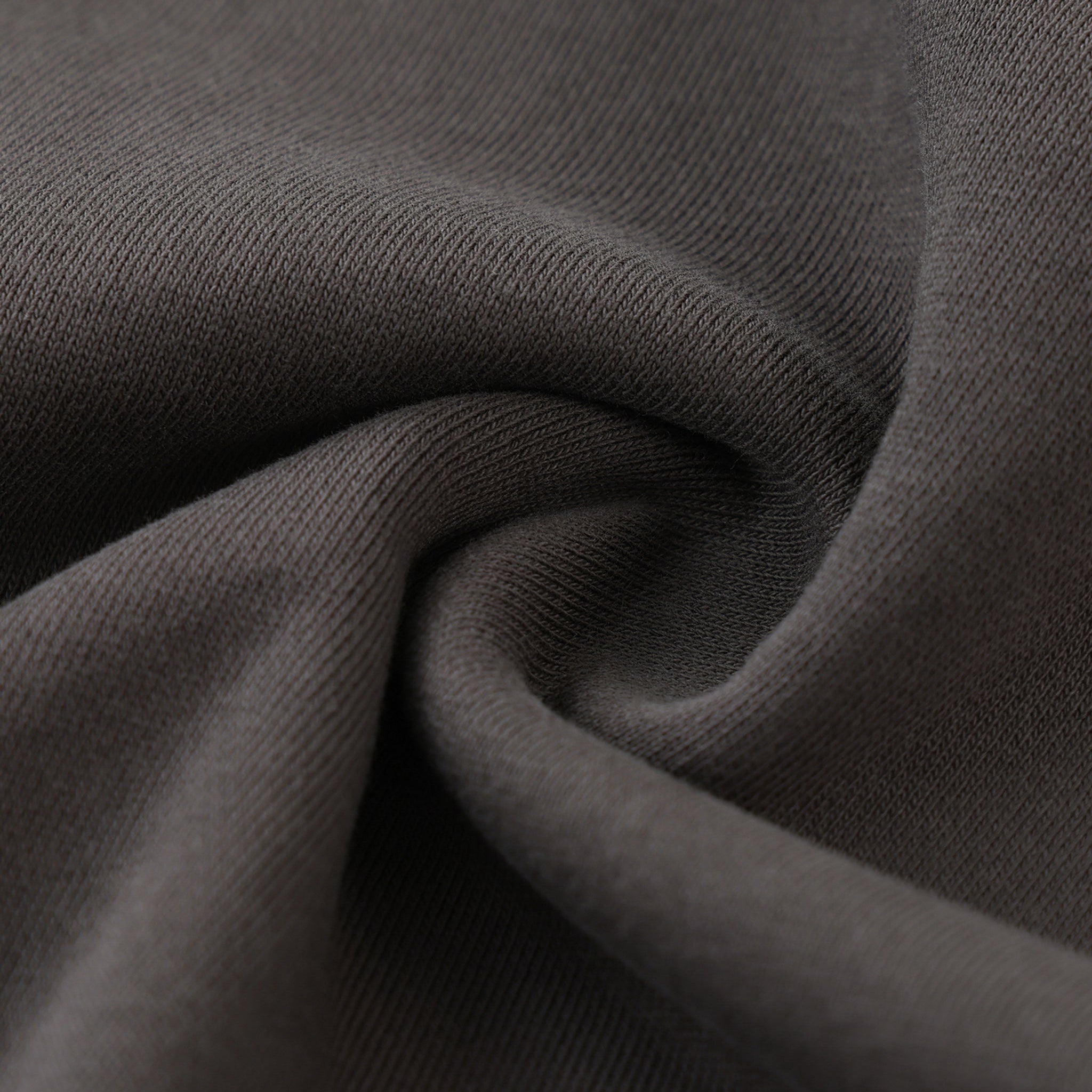 Close-up of dark gray fabric with visible texture