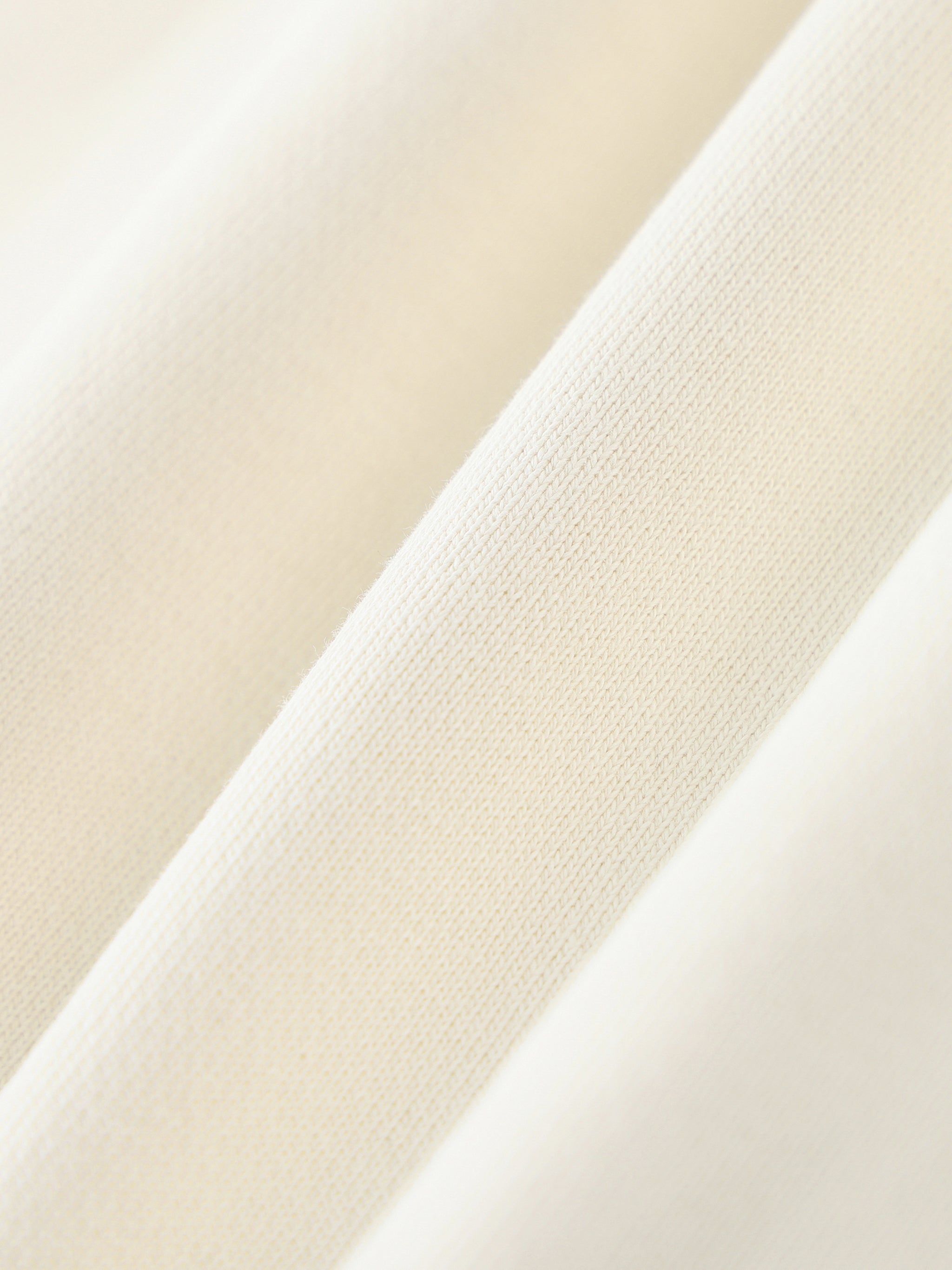 Close-up of beige fabric with a subtle texture