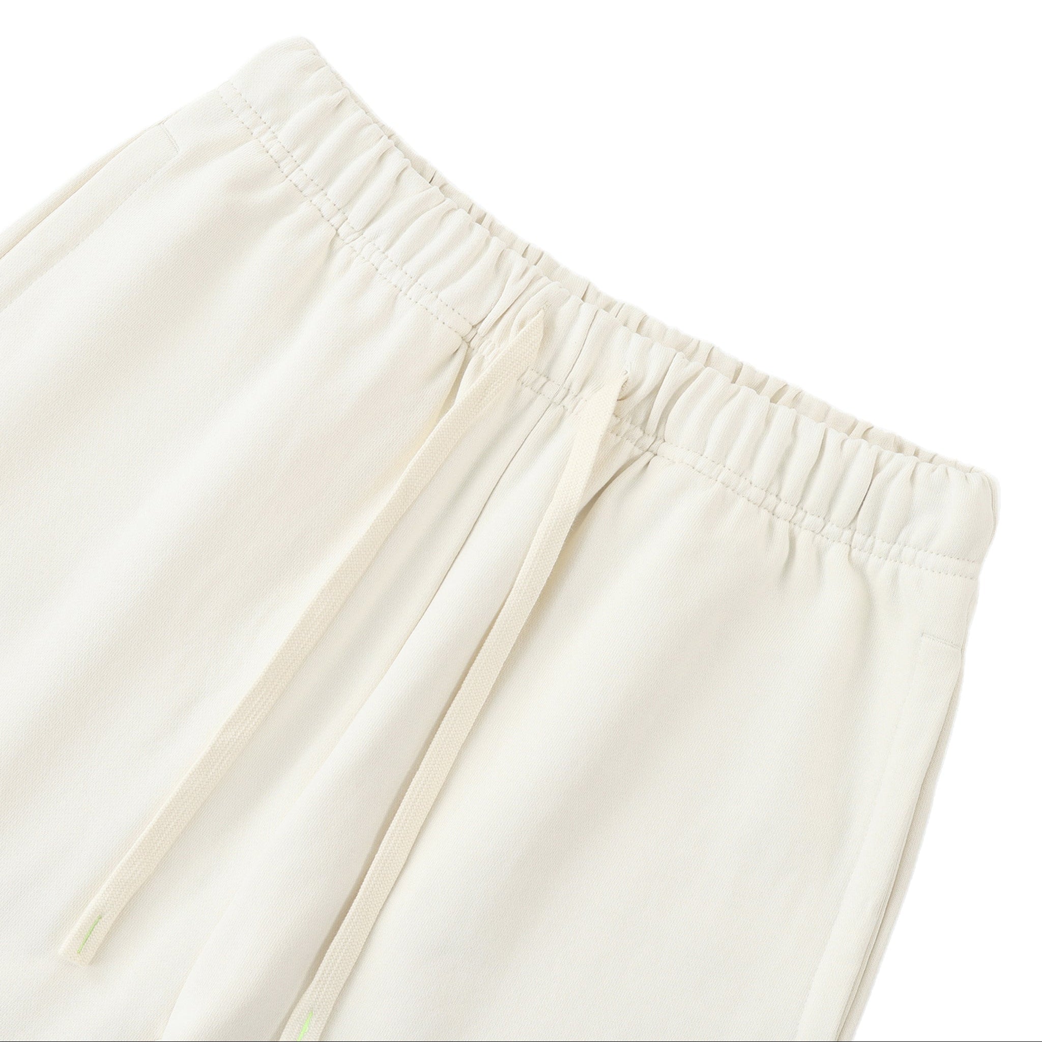 Close-up of beige pants on a white background