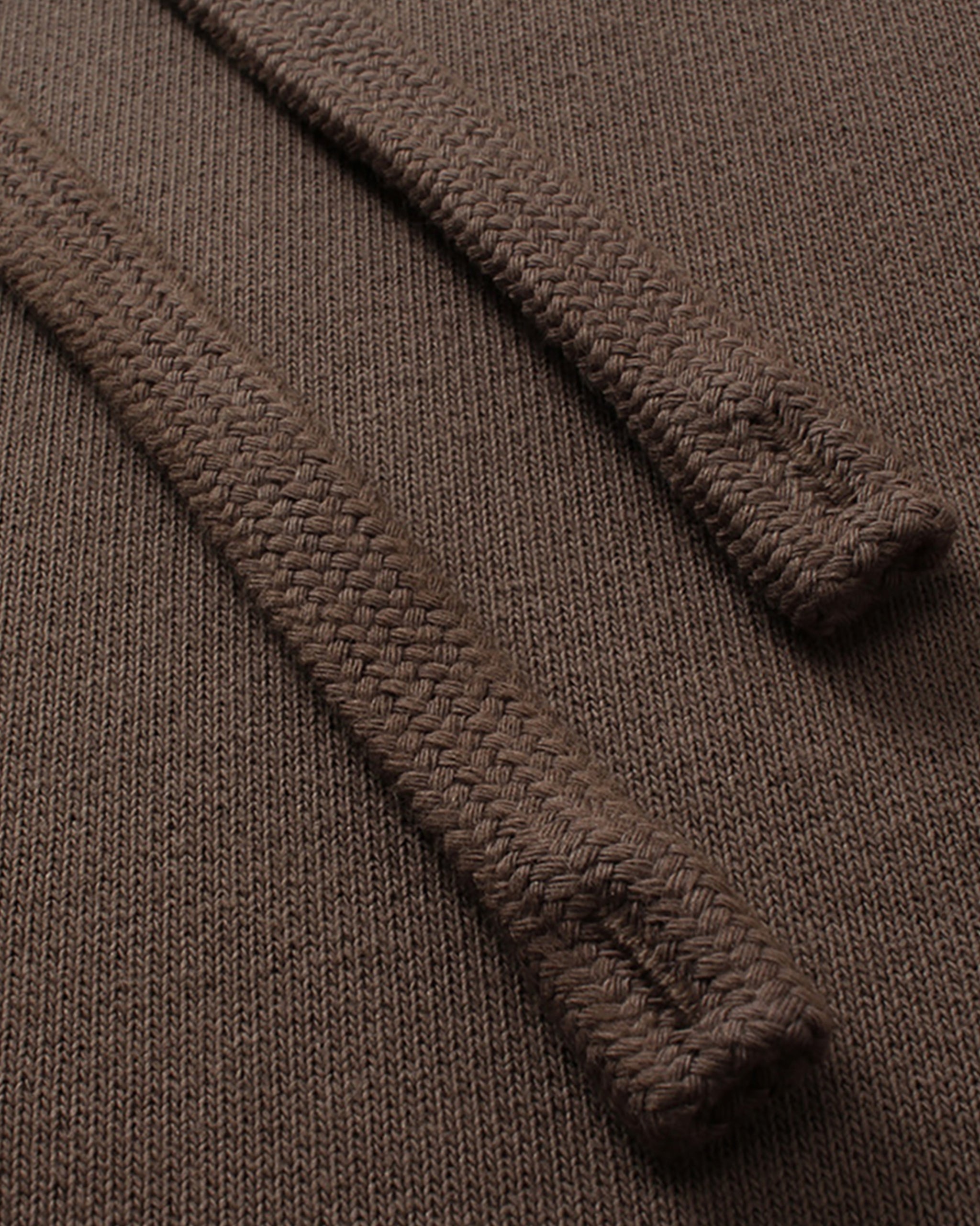 Close-up of a brown textured fabric with a focus on texture and pattern.