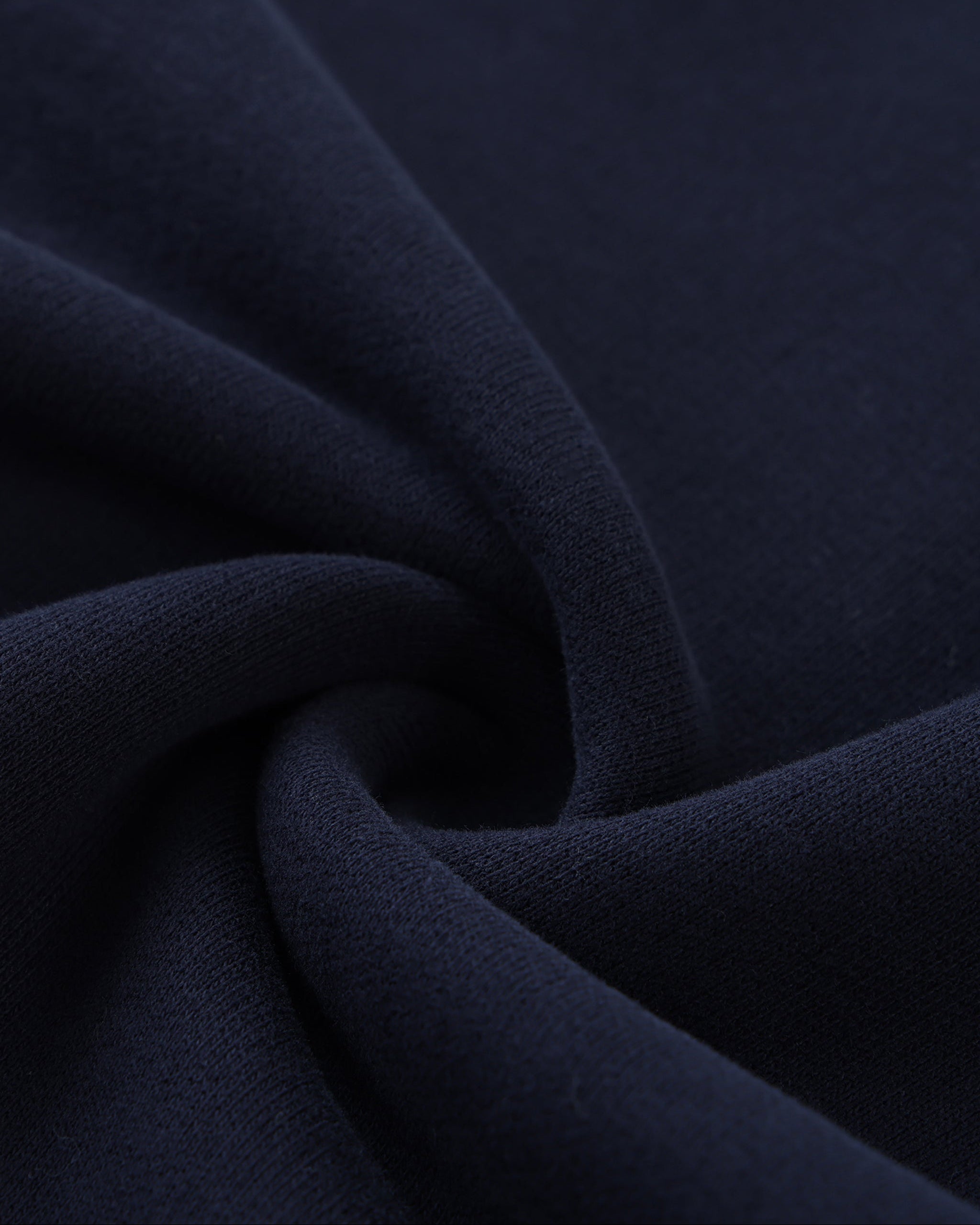 Close-up of dark blue fabric with folds