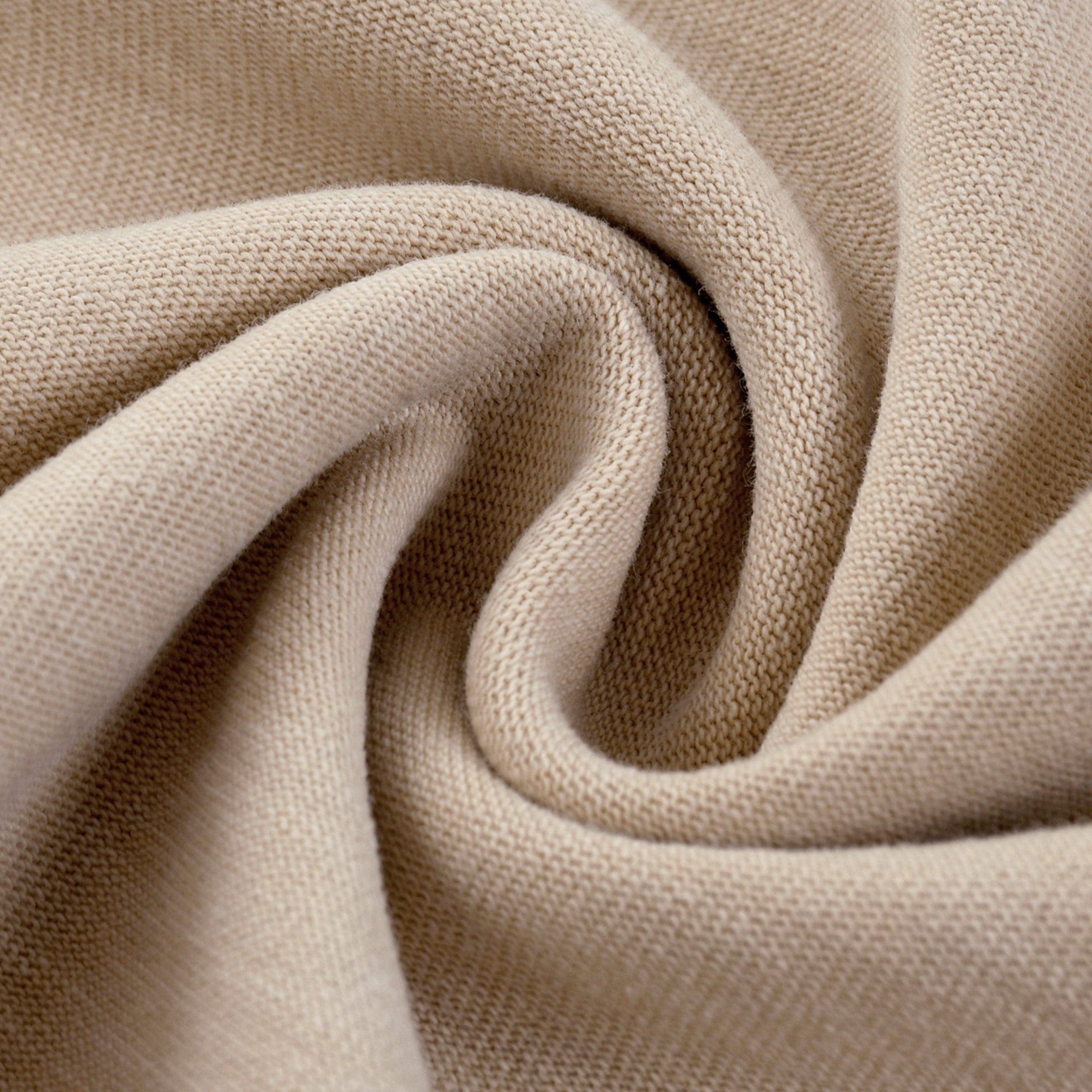 Close-up of beige fabric with a textured pattern