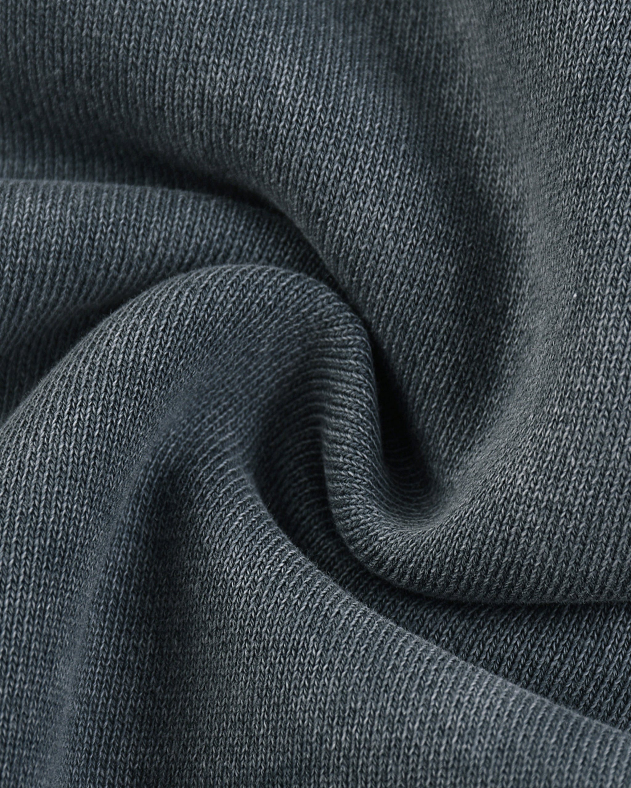 Close-up of dark gray fabric with visible texture