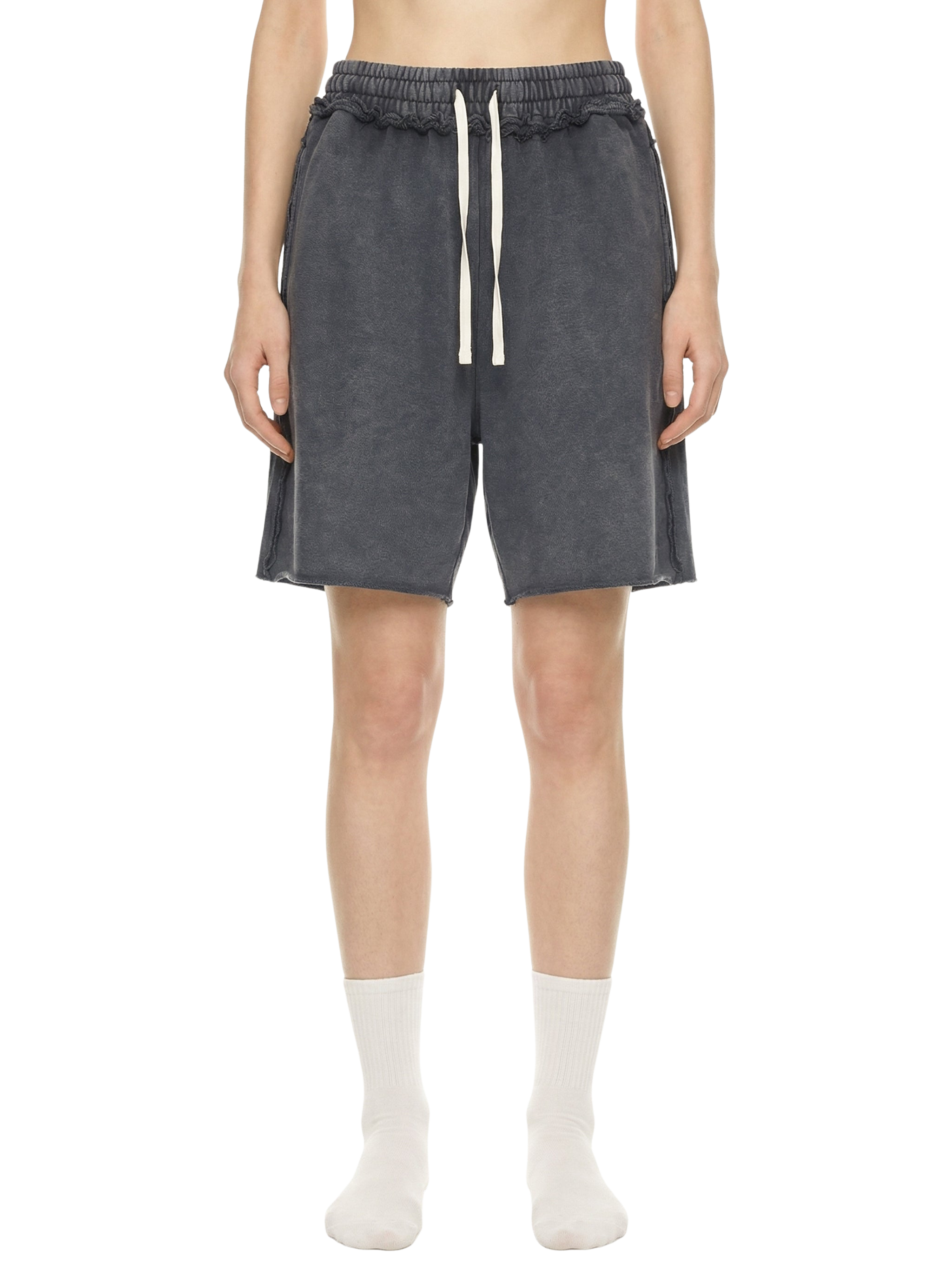 Person wearing dark gray shorts with a drawstring on a white background