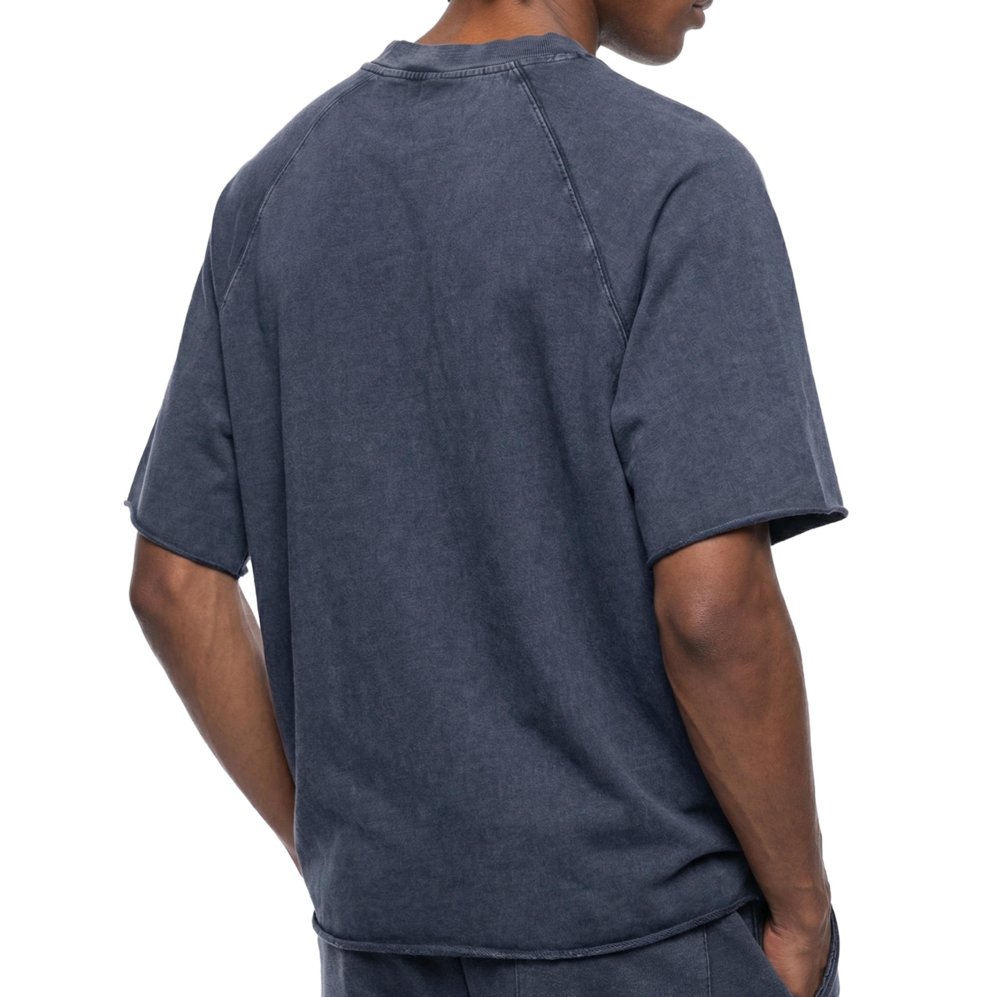 Person wearing a navy blue t-shirt and pants on a white background