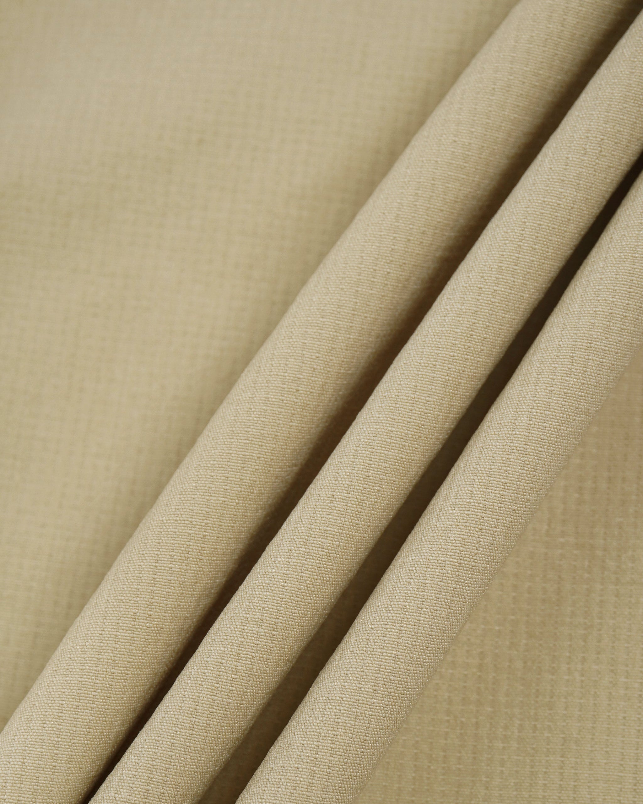 Close-up of beige fabric with a subtle texture