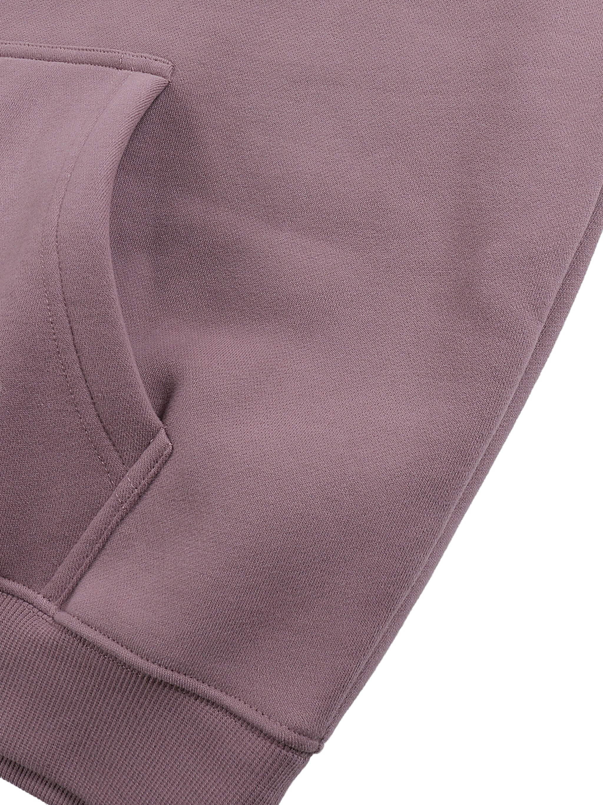 Close-up of a purple sweatshirt with a white background