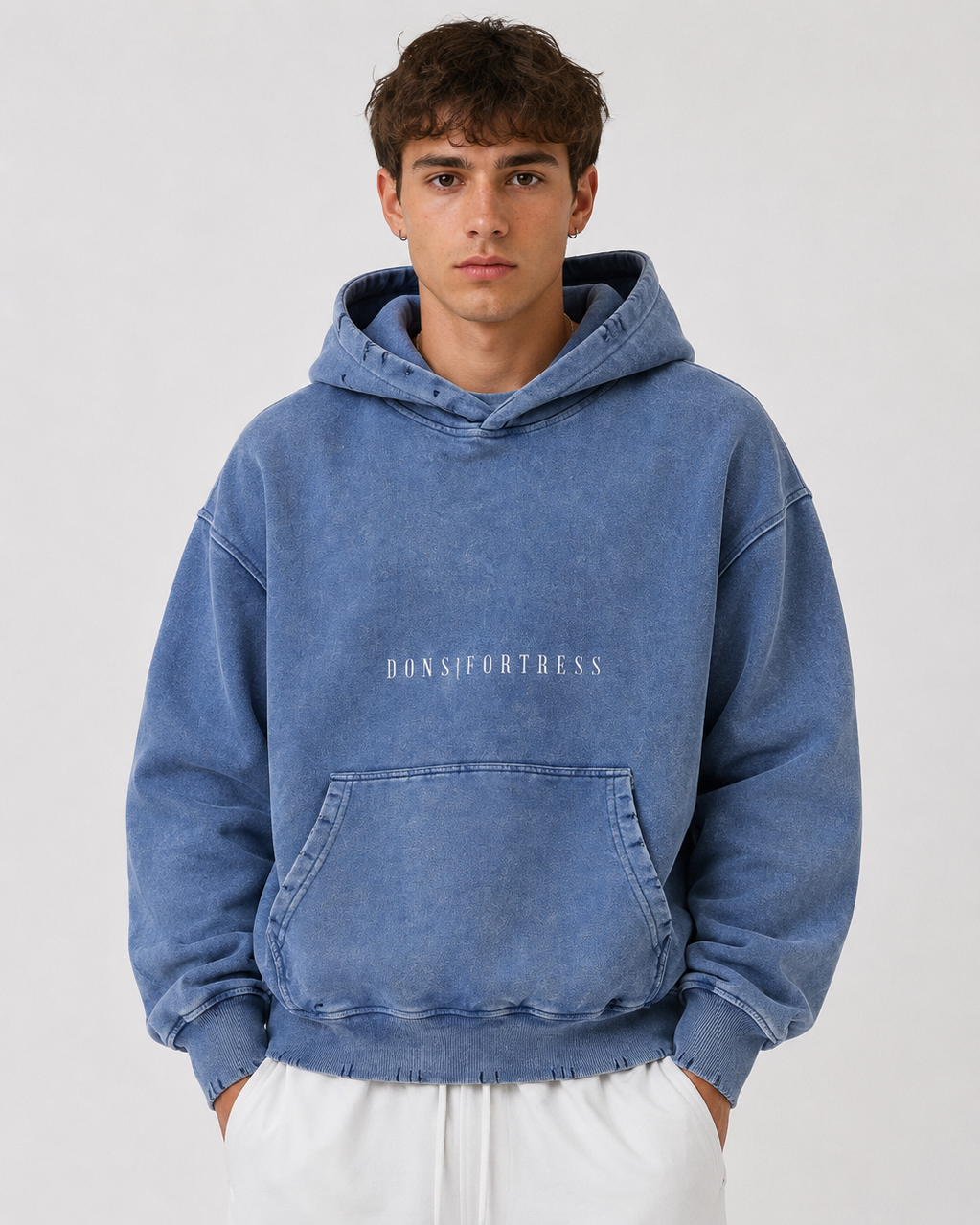 Person wearing a blue hoodie with text on a white background