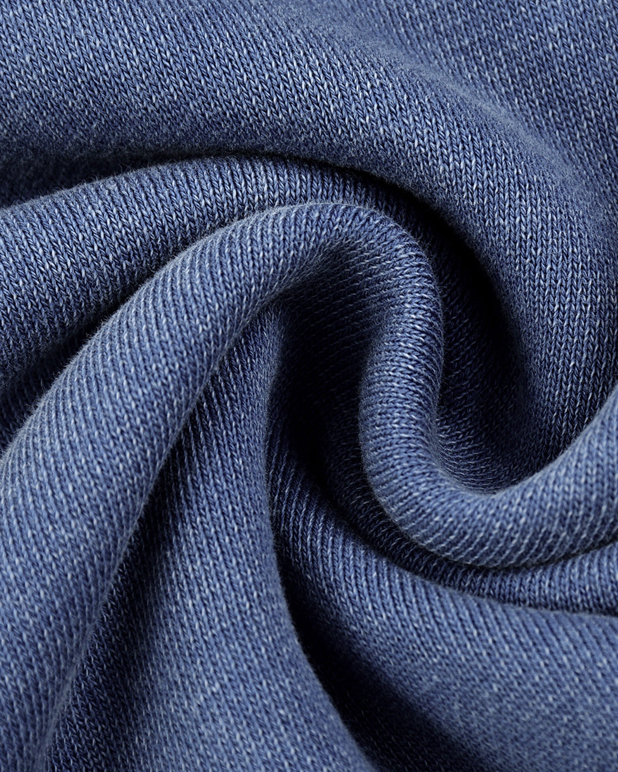 Close-up of blue fabric with a textured pattern