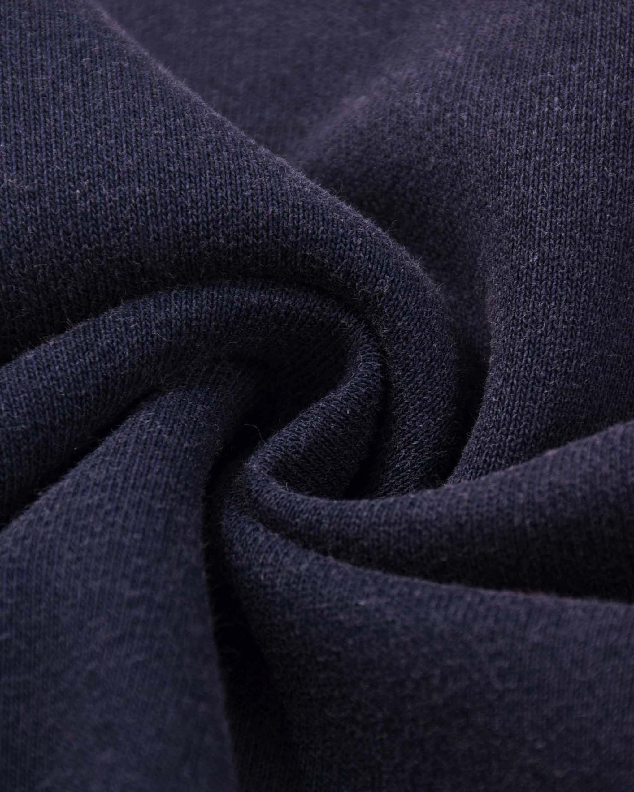 Close-up of dark blue fabric with a textured pattern