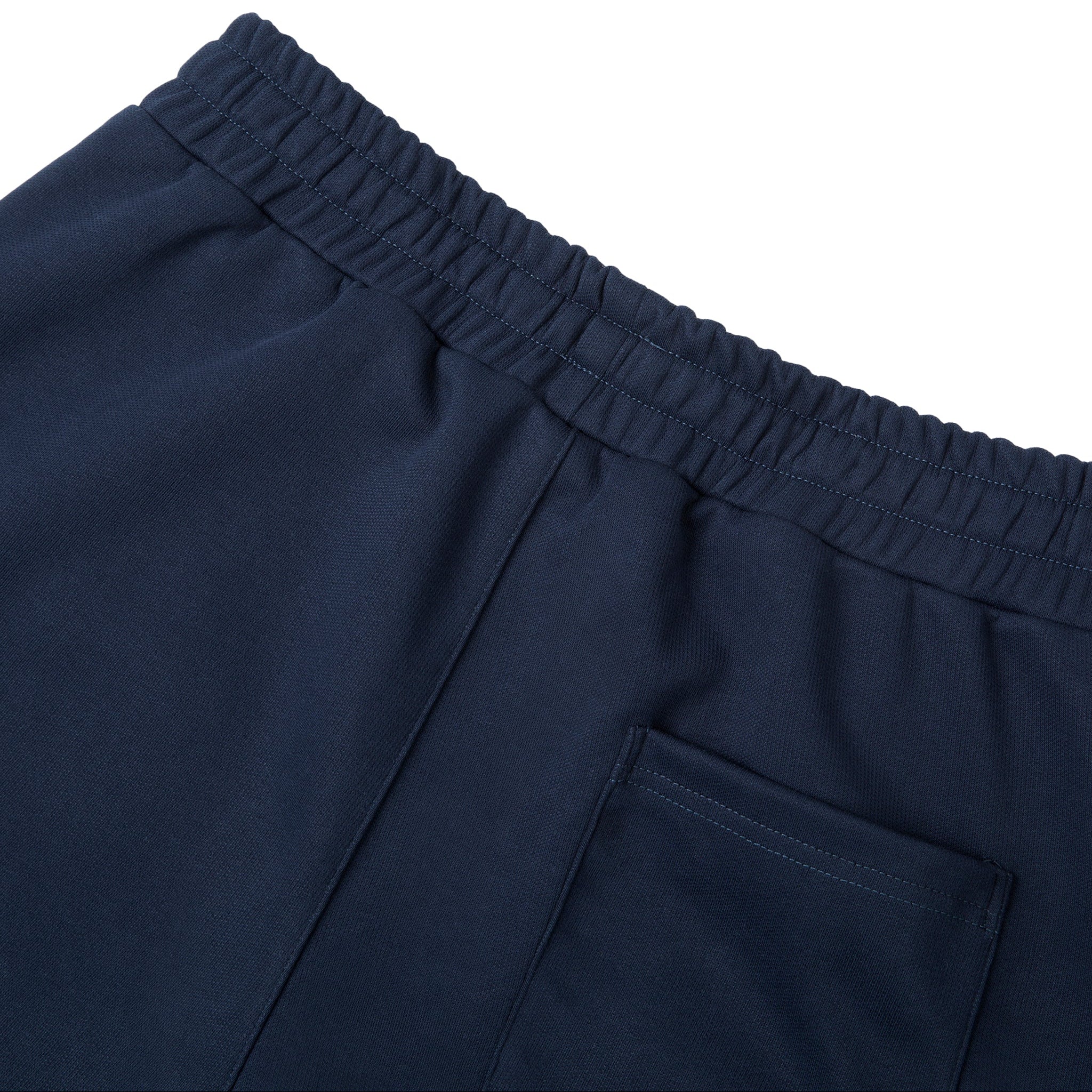 Close-up of navy blue pants with an elastic waistband on a white background