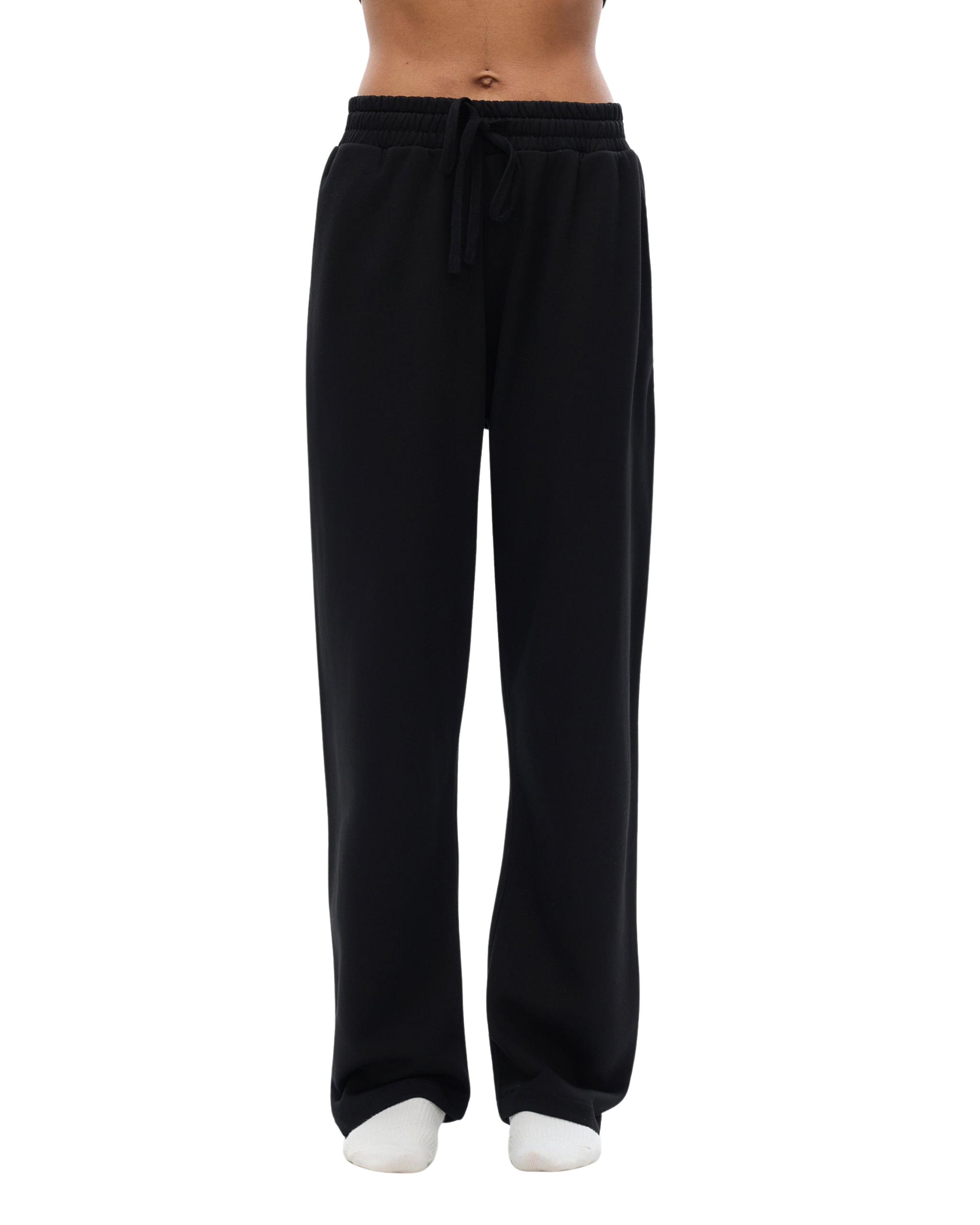 Black sweatpants worn by a person on a white background