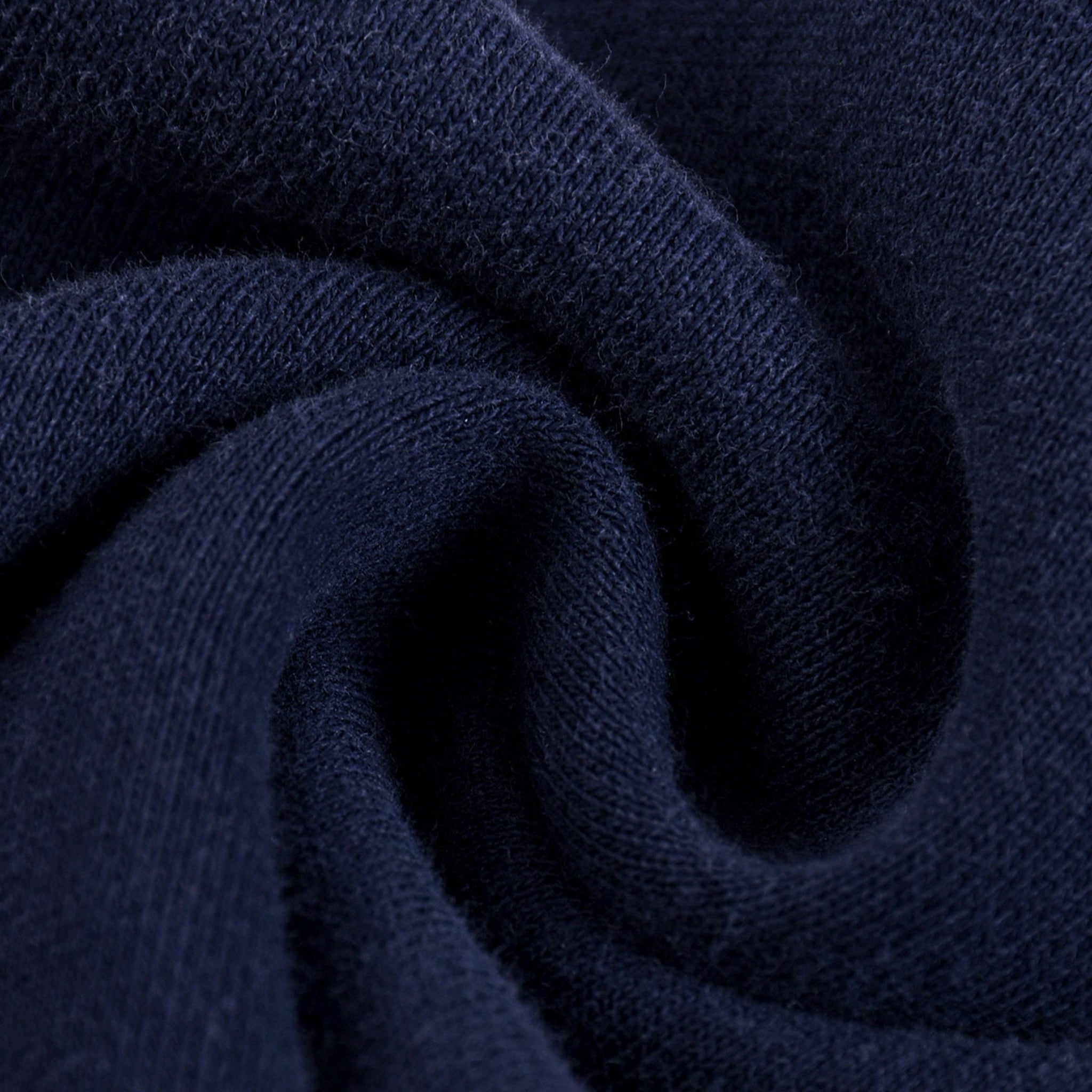 Close-up of dark blue fabric with a textured pattern