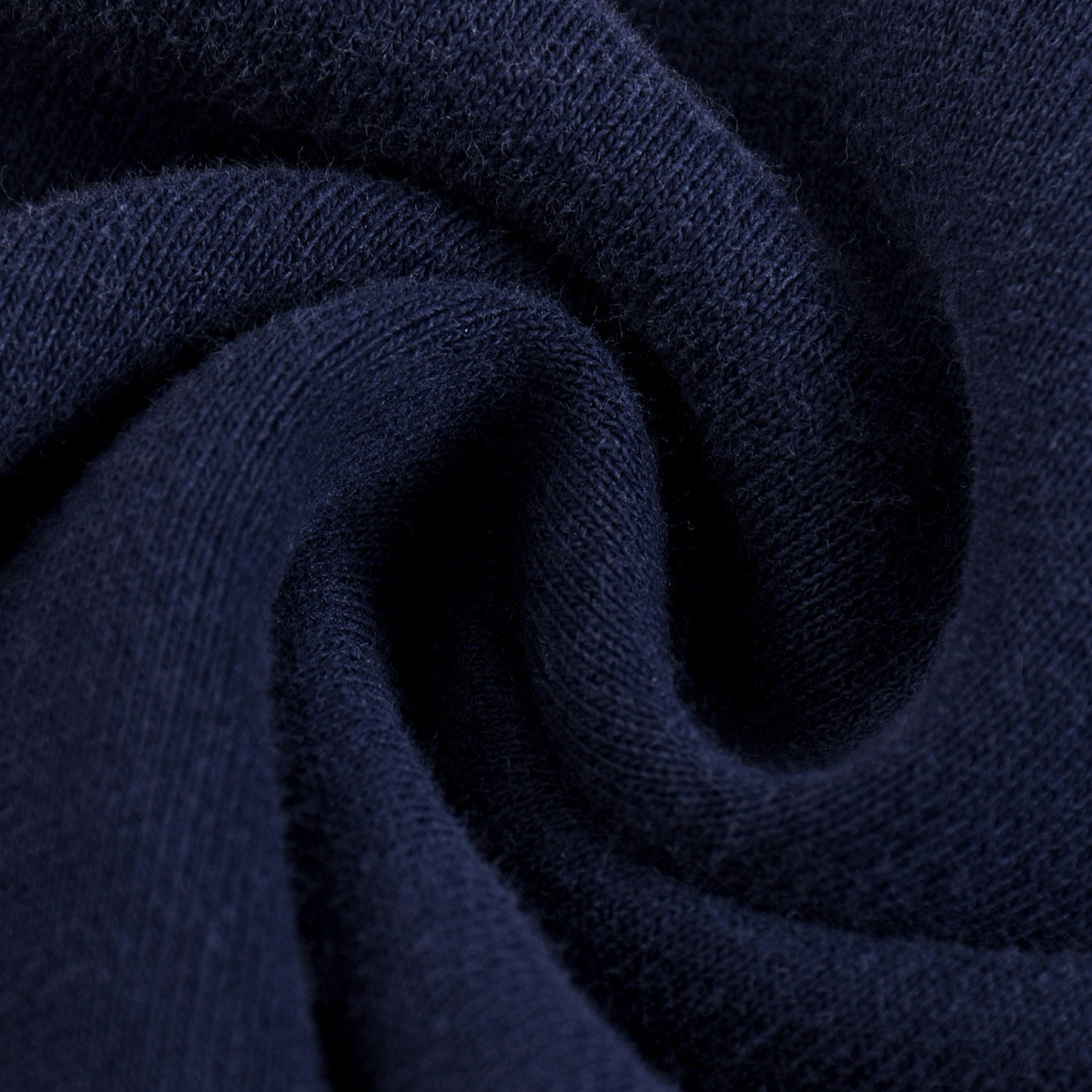 Close-up of dark blue fabric with a textured pattern
