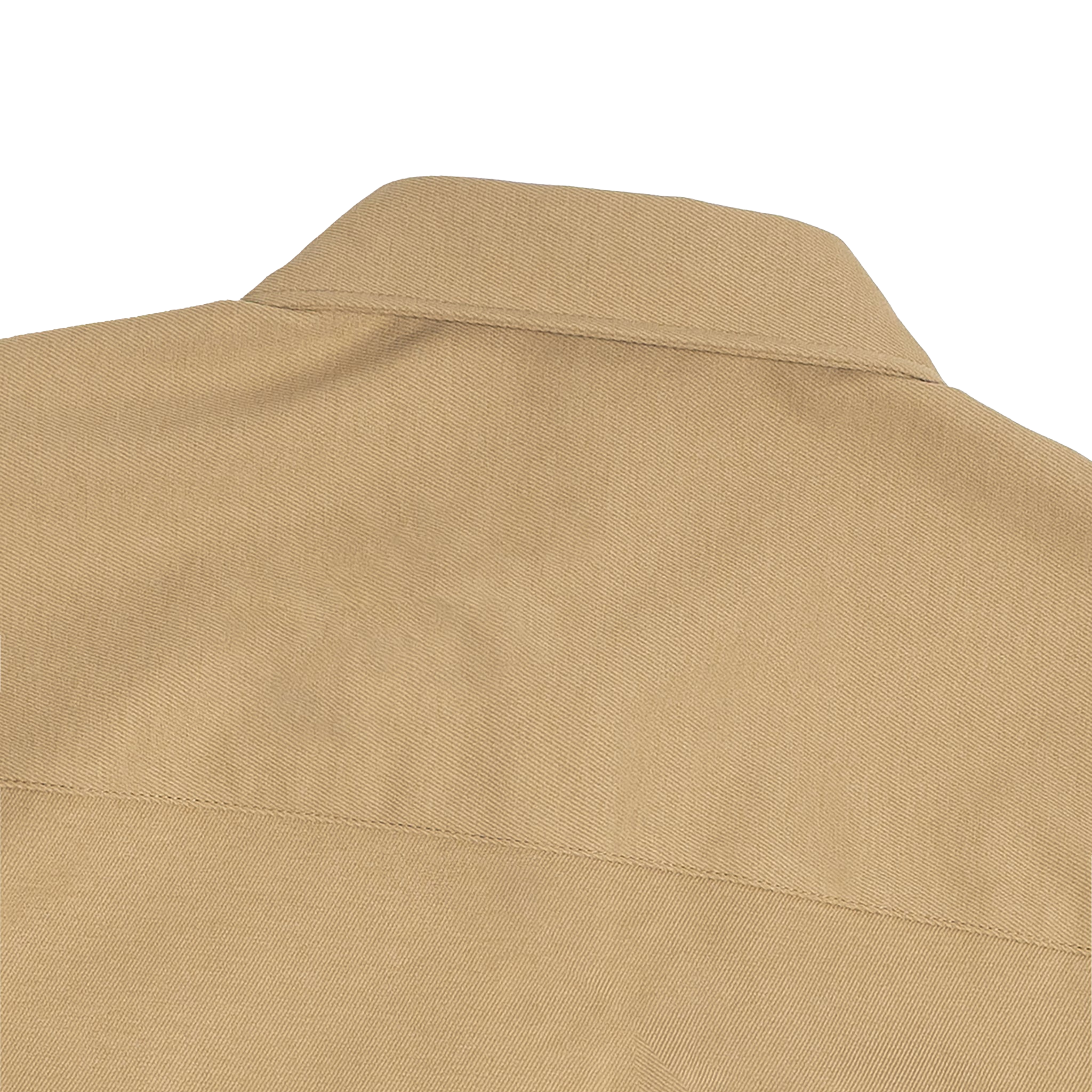 Close-up of a beige shirt collar on a white background