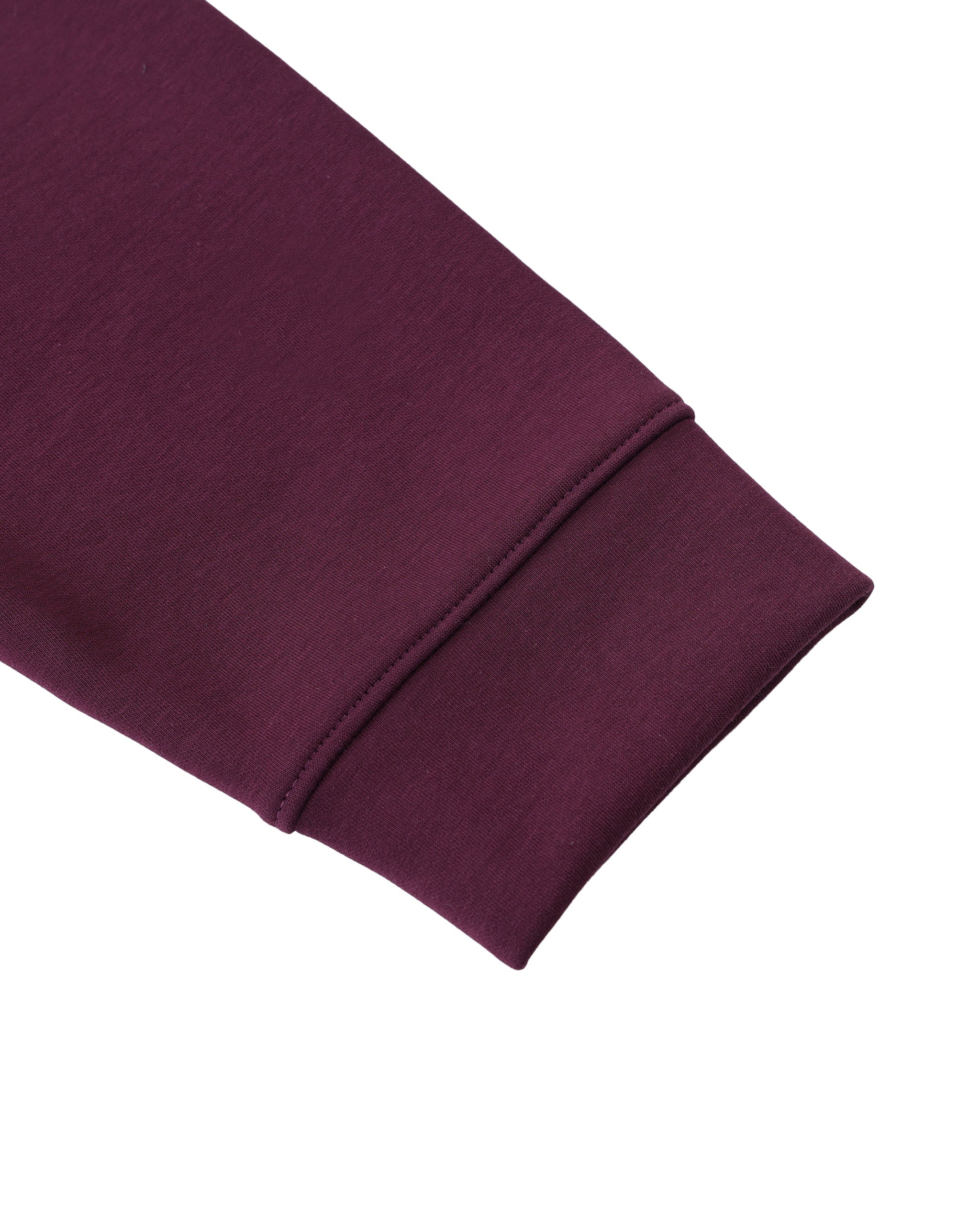 Close-up of a folded purple fabric on a white background