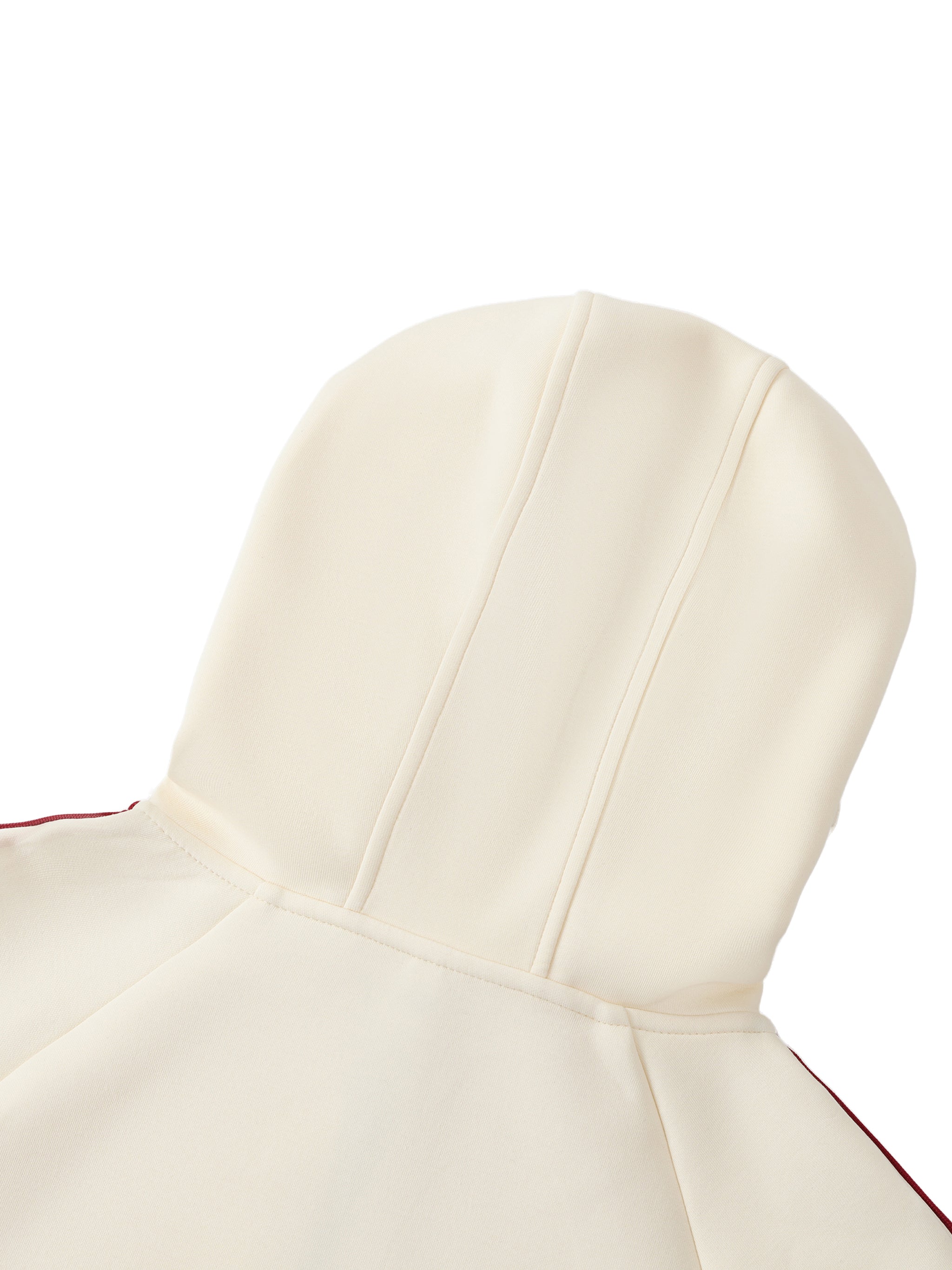 Close-up of a white hooded garment with red accents on a white background