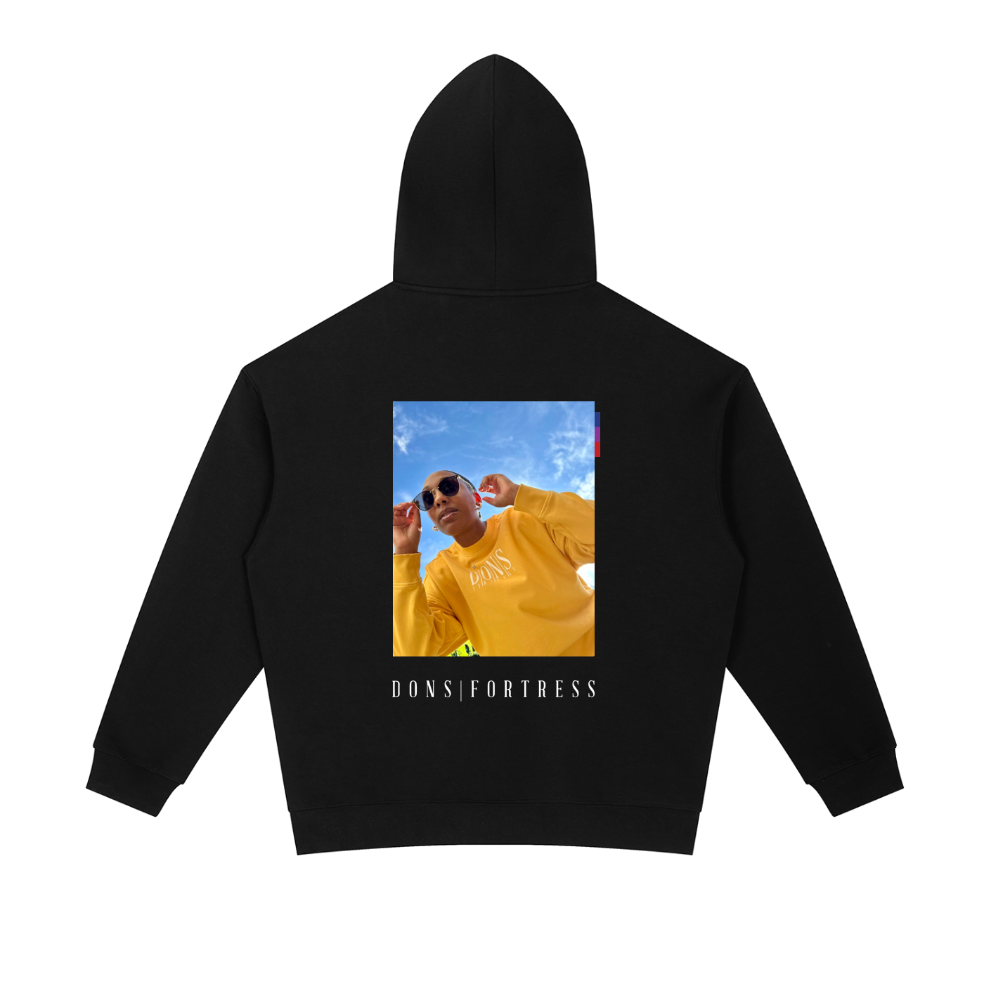 Black hoodie with a printed design on the back featuring a person in a yellow outfit and 'Dons Fortress' text.