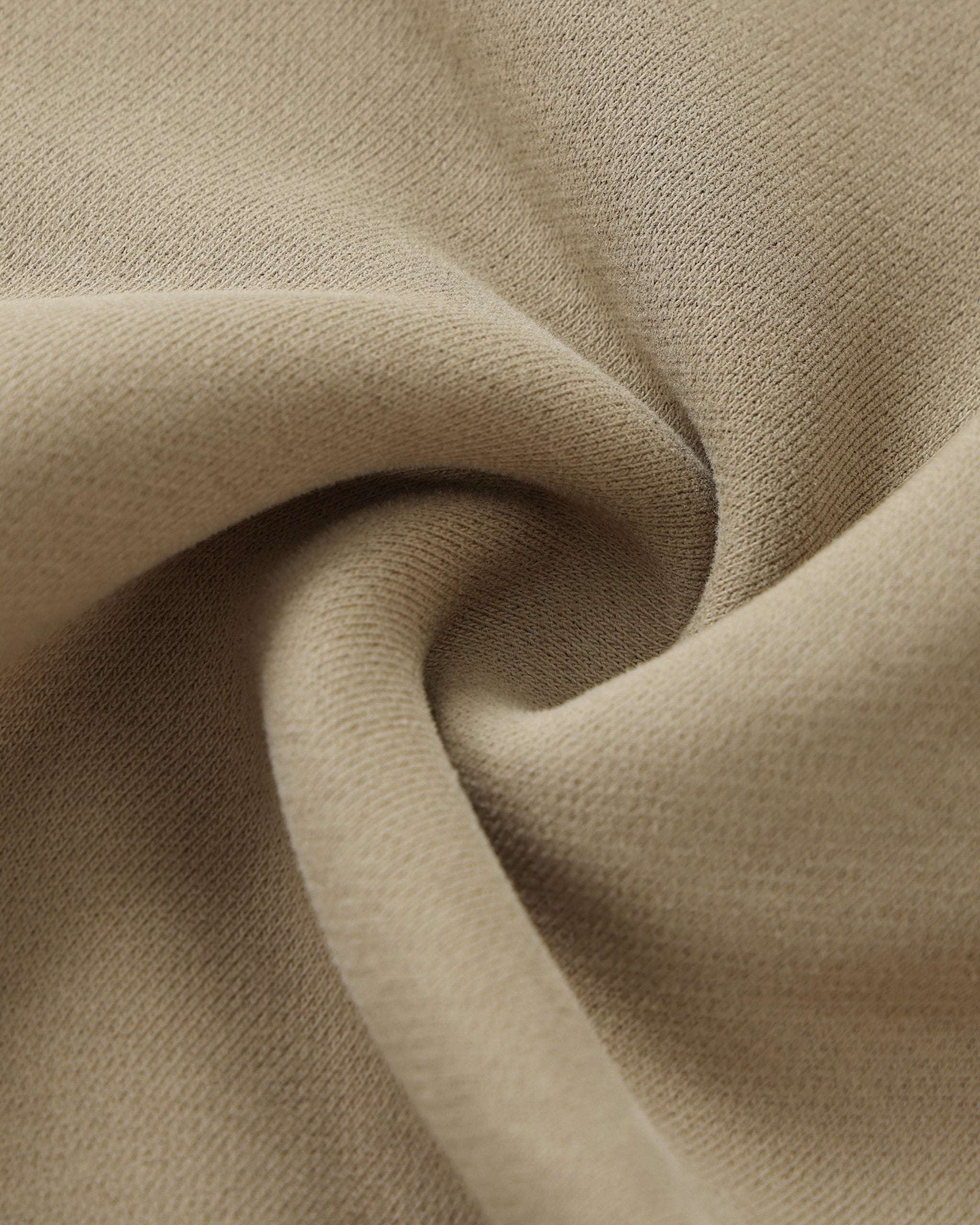 Close-up of beige fabric with folds