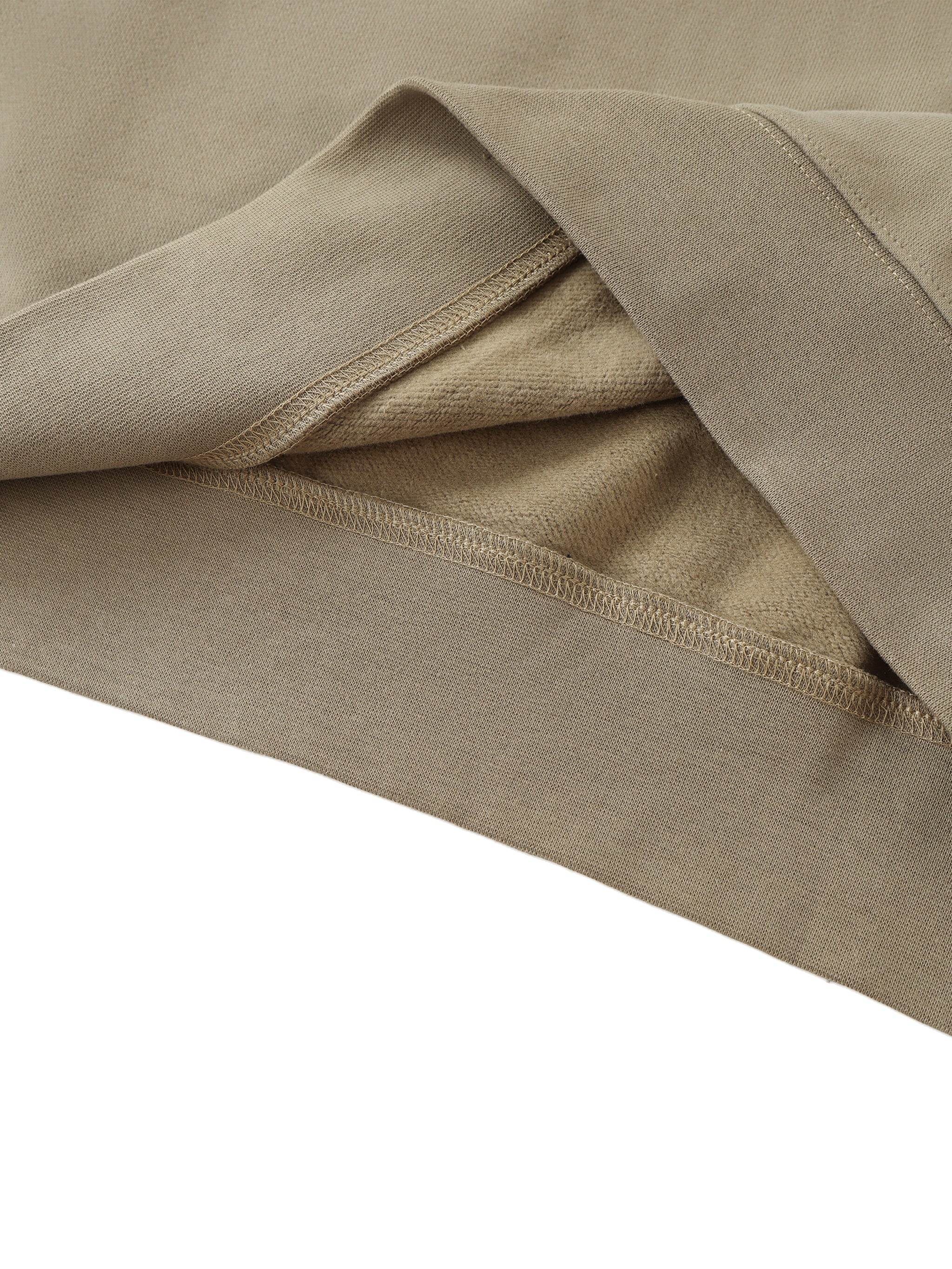 Close-up of beige fabric with a white background