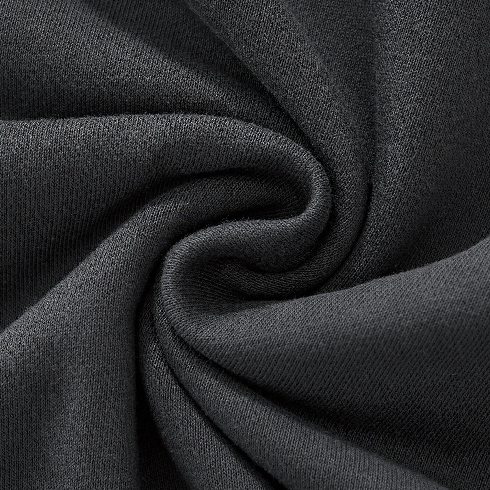 Close-up of dark gray fabric with folds