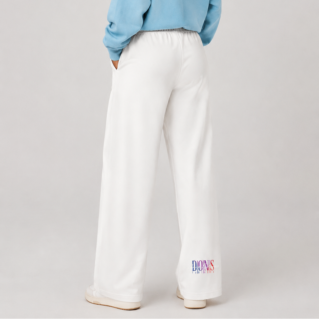 Person wearing a light blue hoodie and white pants on a plain background