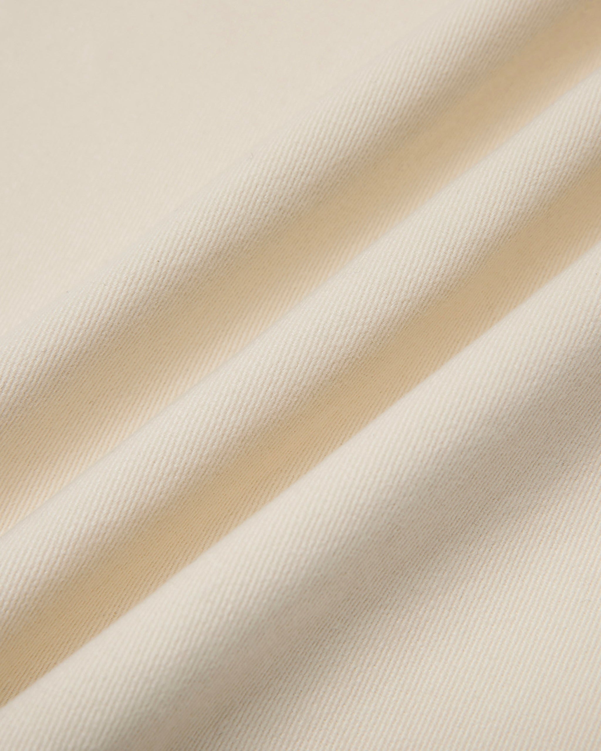 Close-up of beige fabric with folds