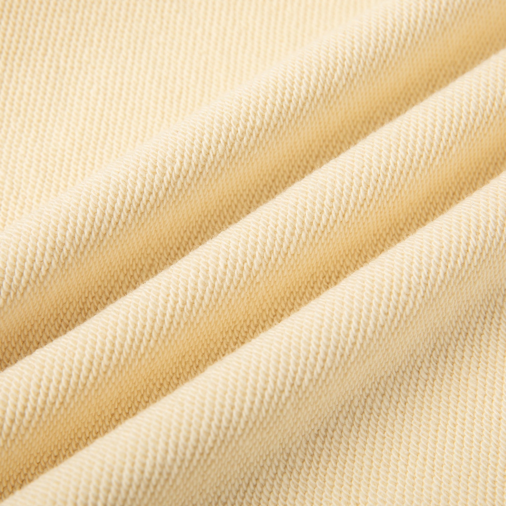 Close-up of beige fabric with a textured pattern