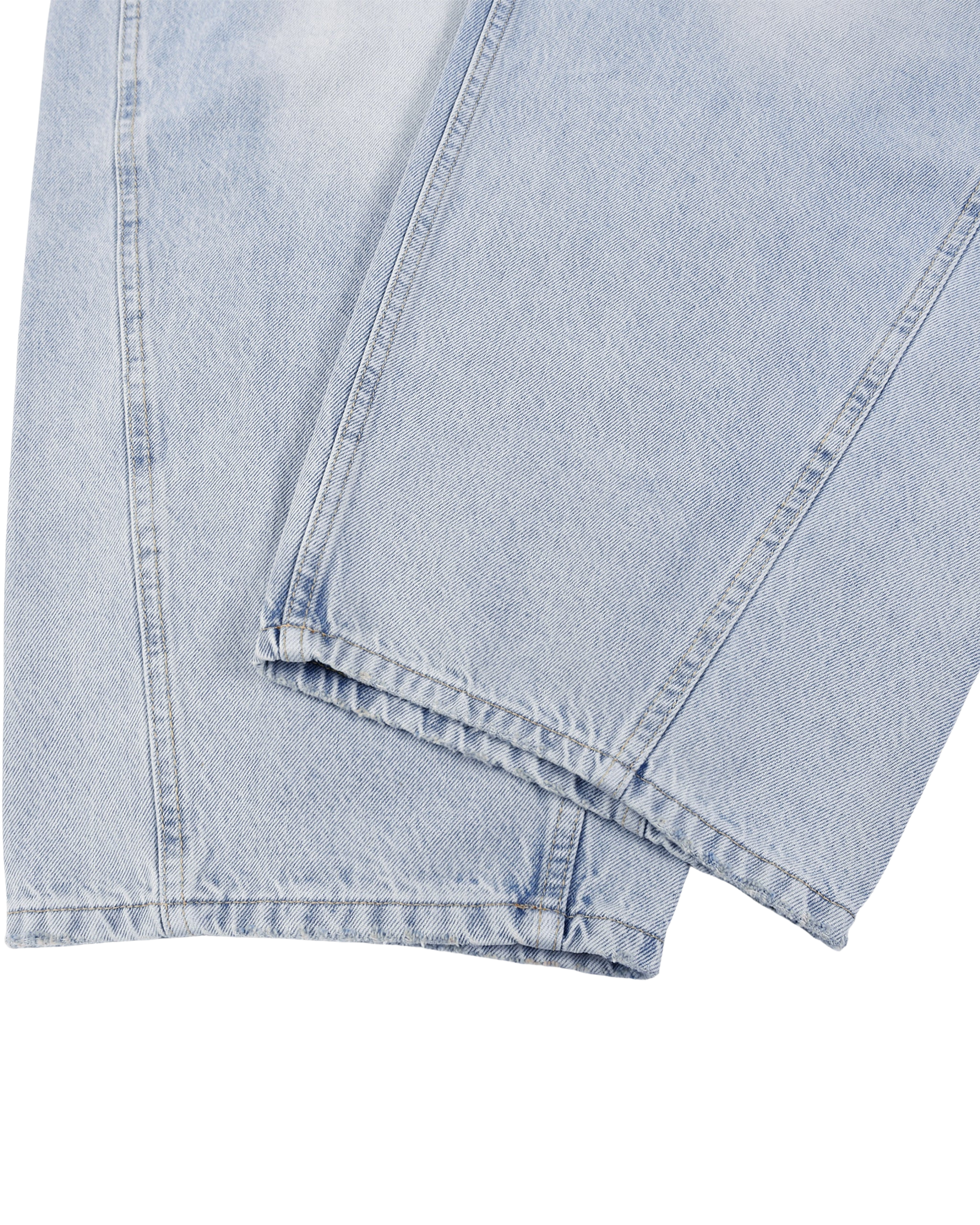 Close-up of light blue denim fabric on a white background