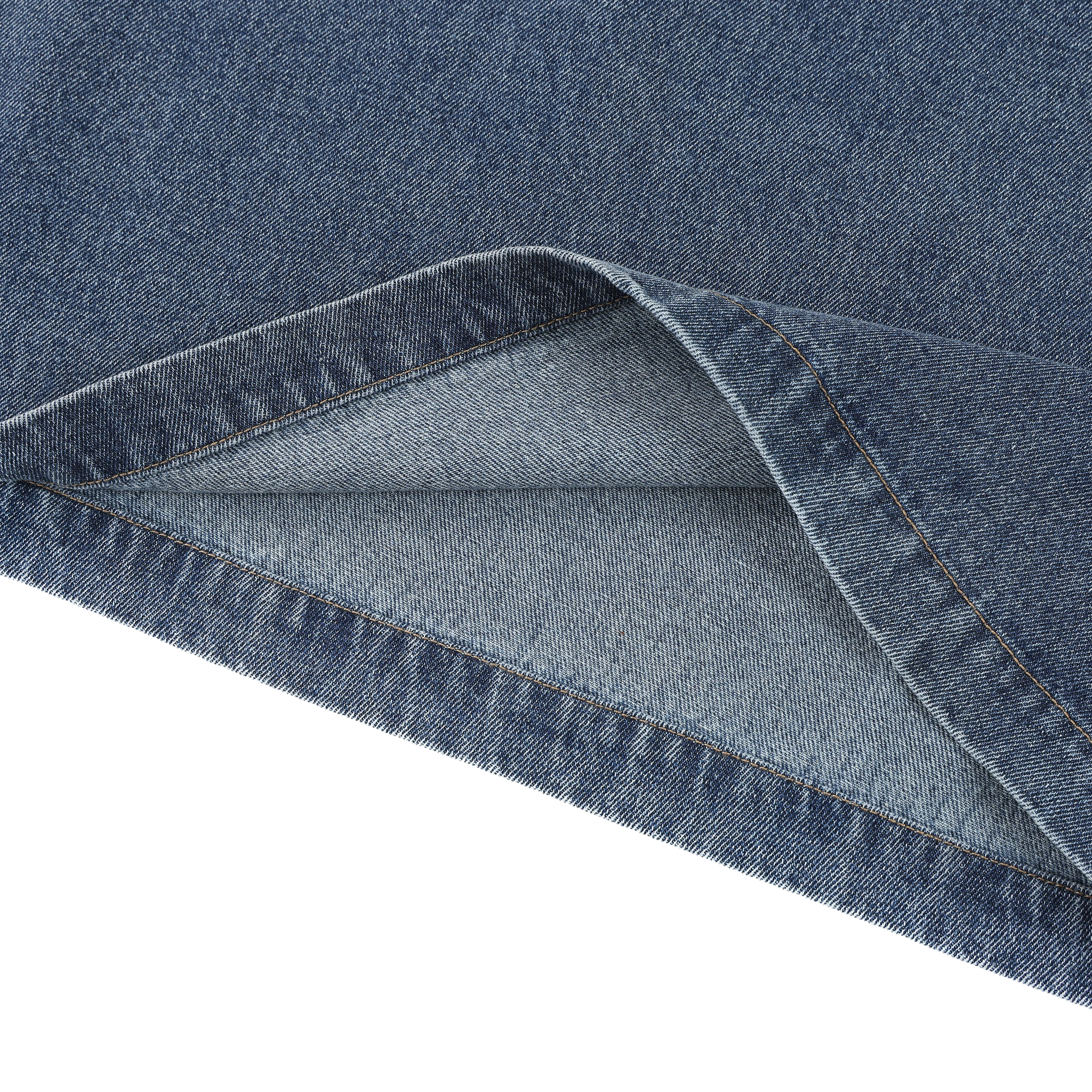 Close-up of blue denim fabric on a white background