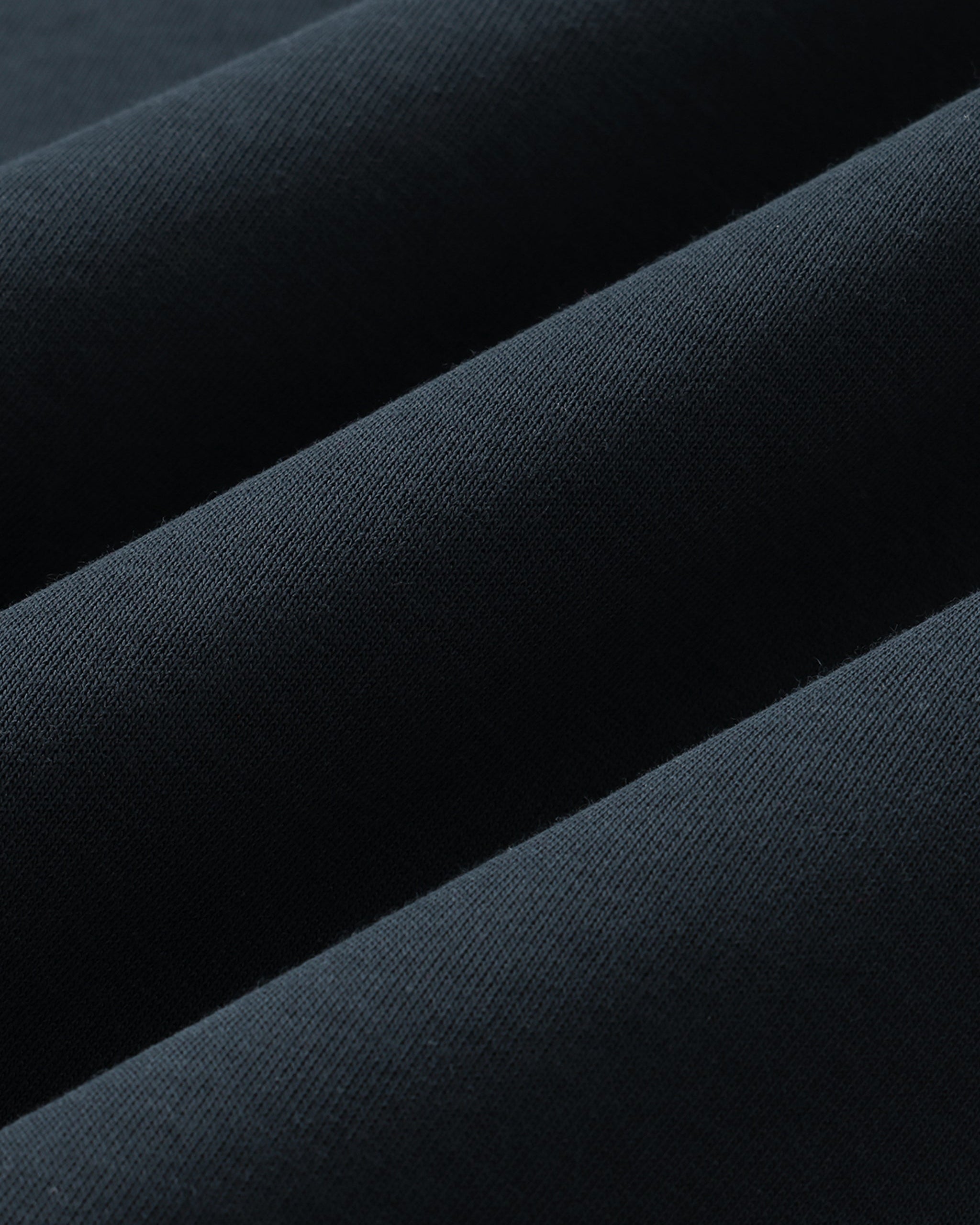 Close-up of dark blue fabric with a subtle texture