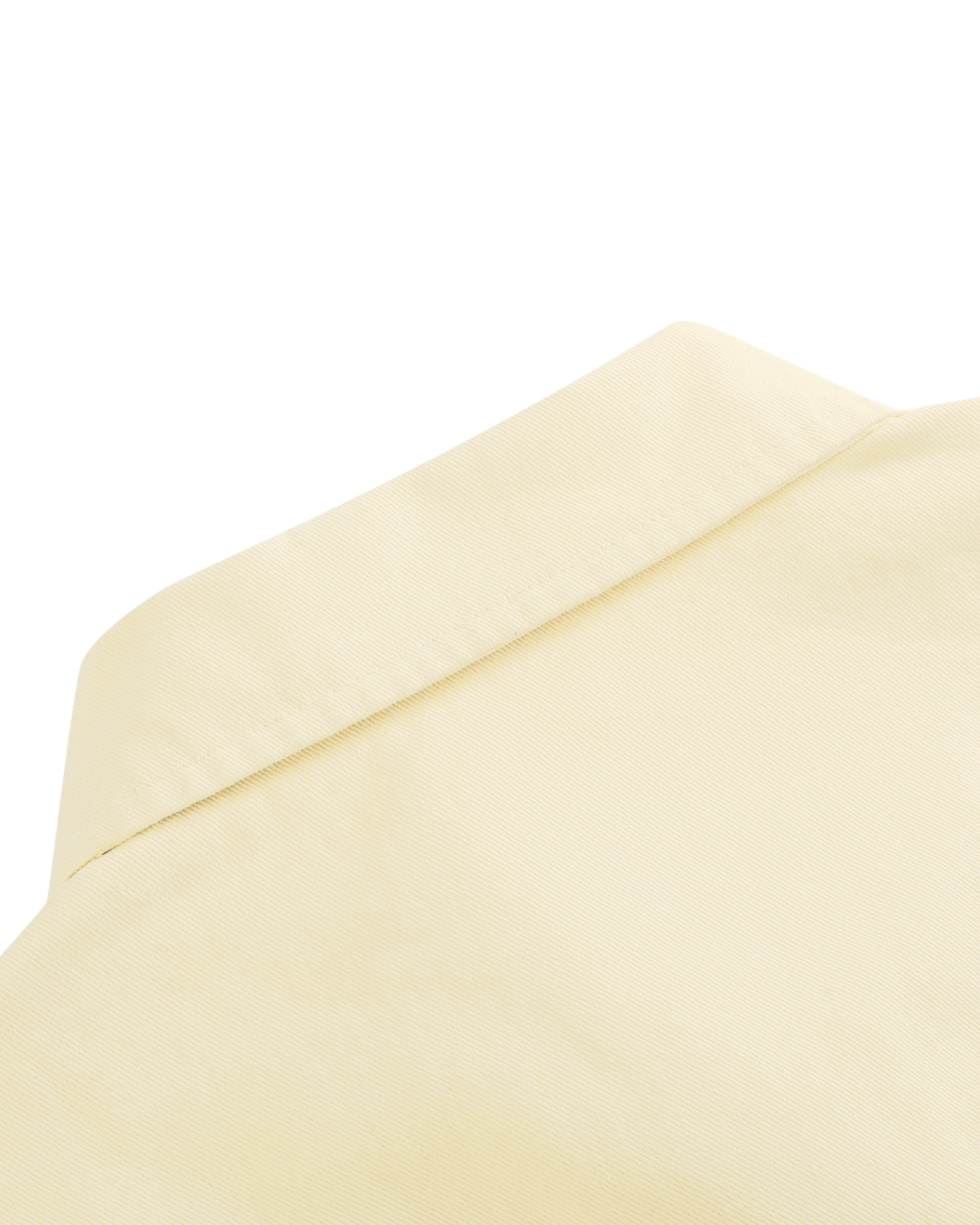 Close-up of a beige envelope corner on a white background