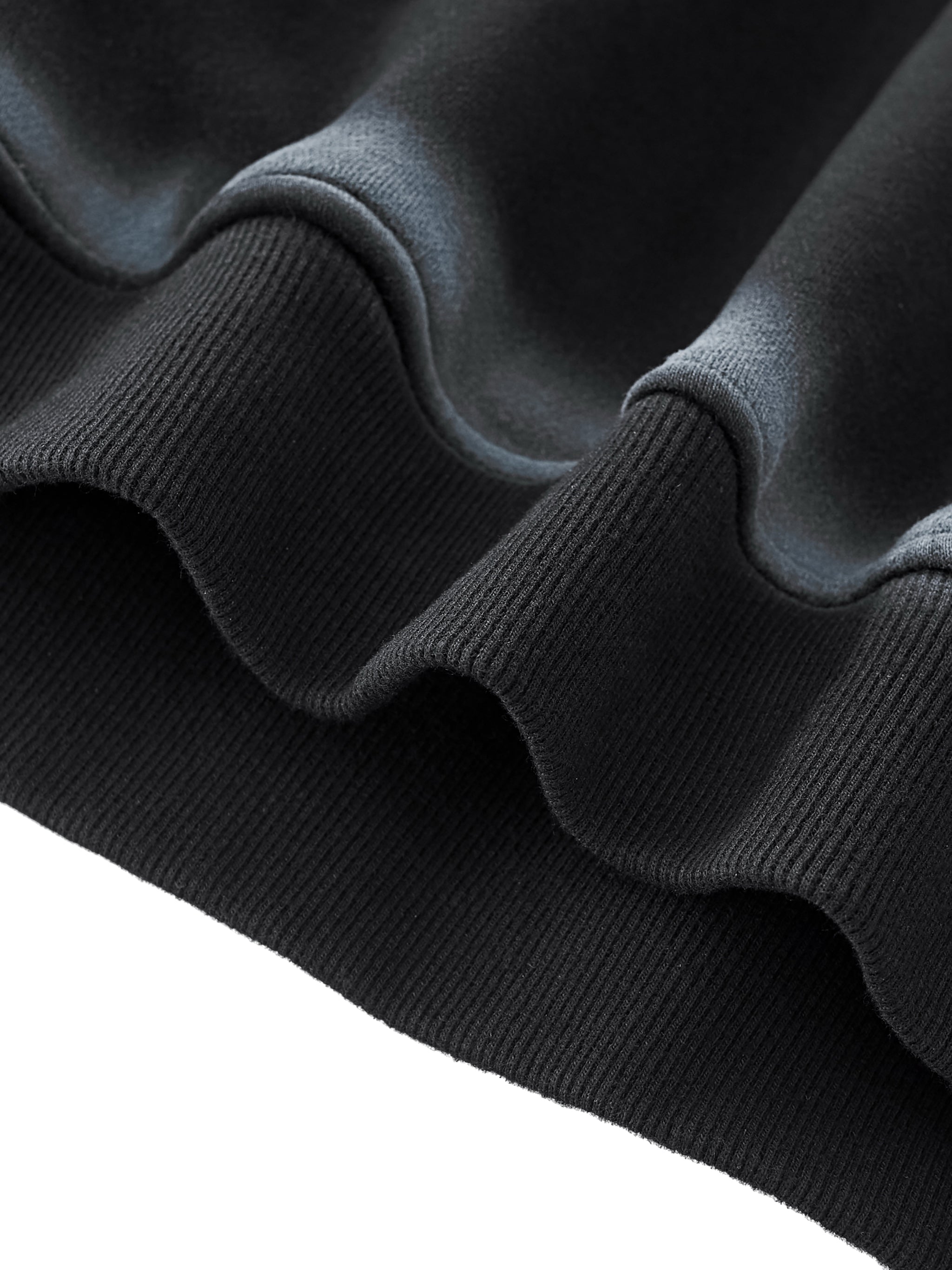 Close-up of a washed black and gray textured fabric edge