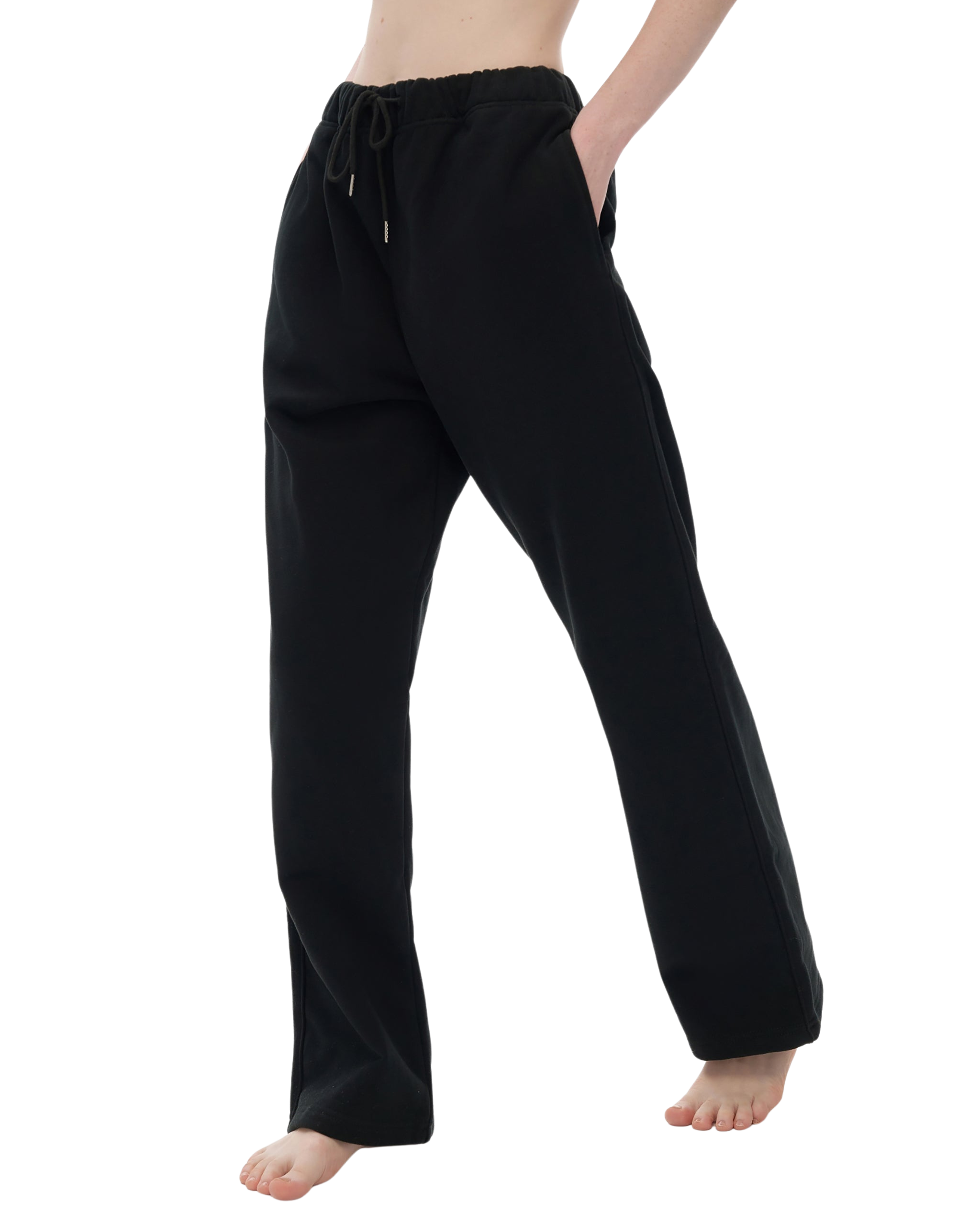 Black pants worn by a person on a white background