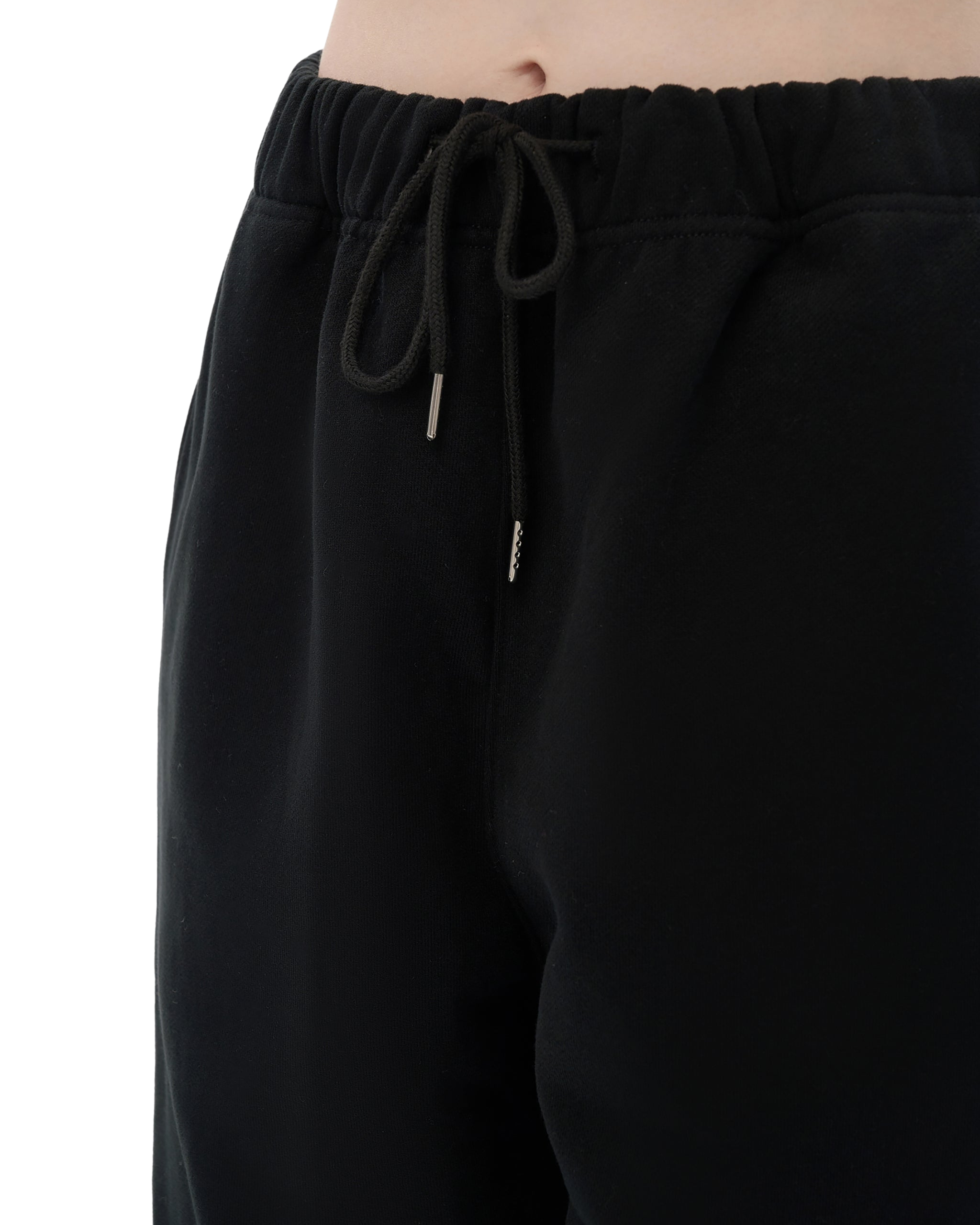 Black drawstring pants on a white background